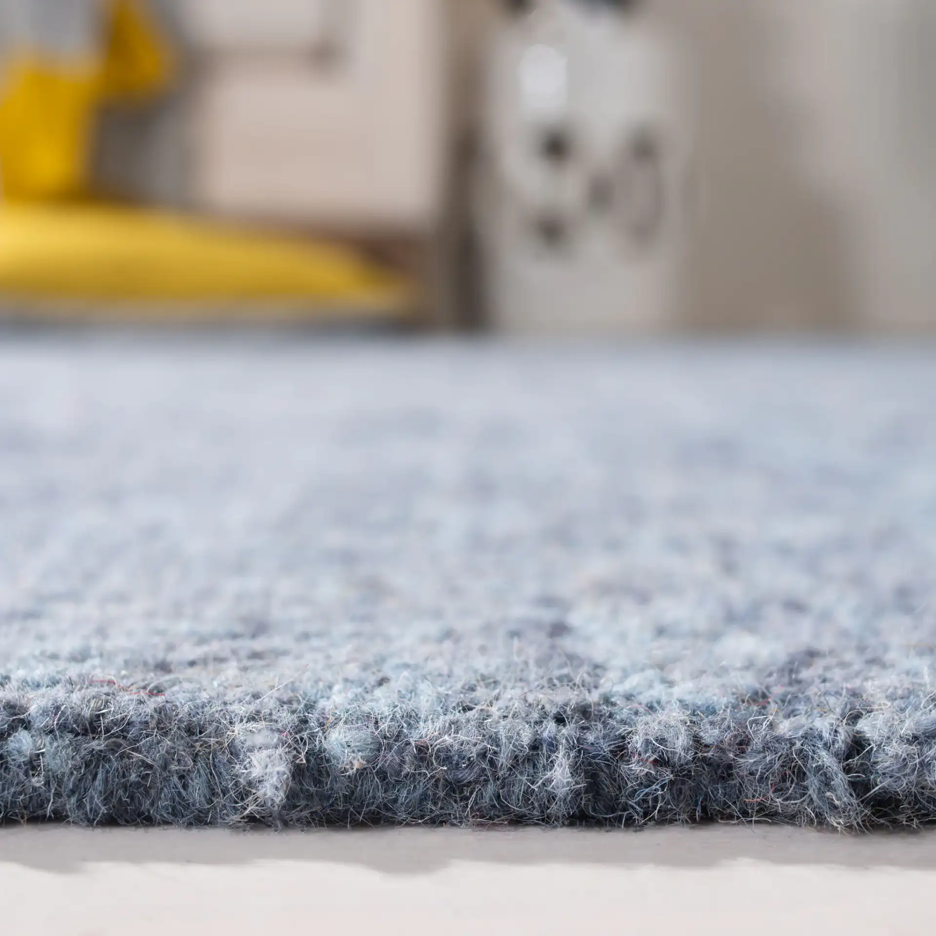 Abstract Transitional Allover Rosette Hand-Tufted Wool Rug in Blue in a styled room