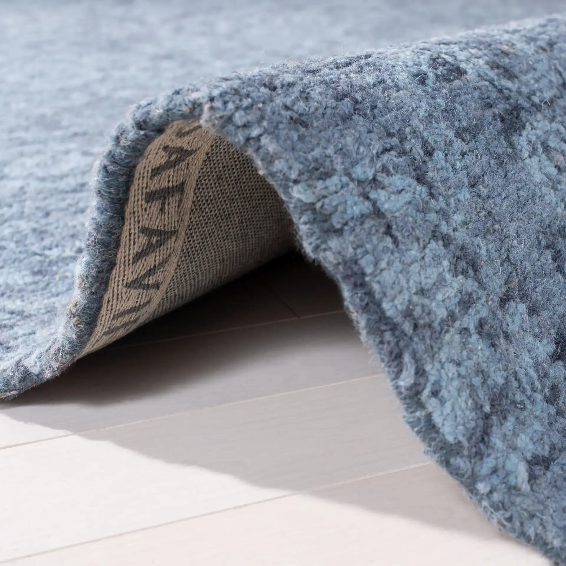 Abstract Transitional Allover Rosette Hand-Tufted Wool Rug in Blue in a styled room