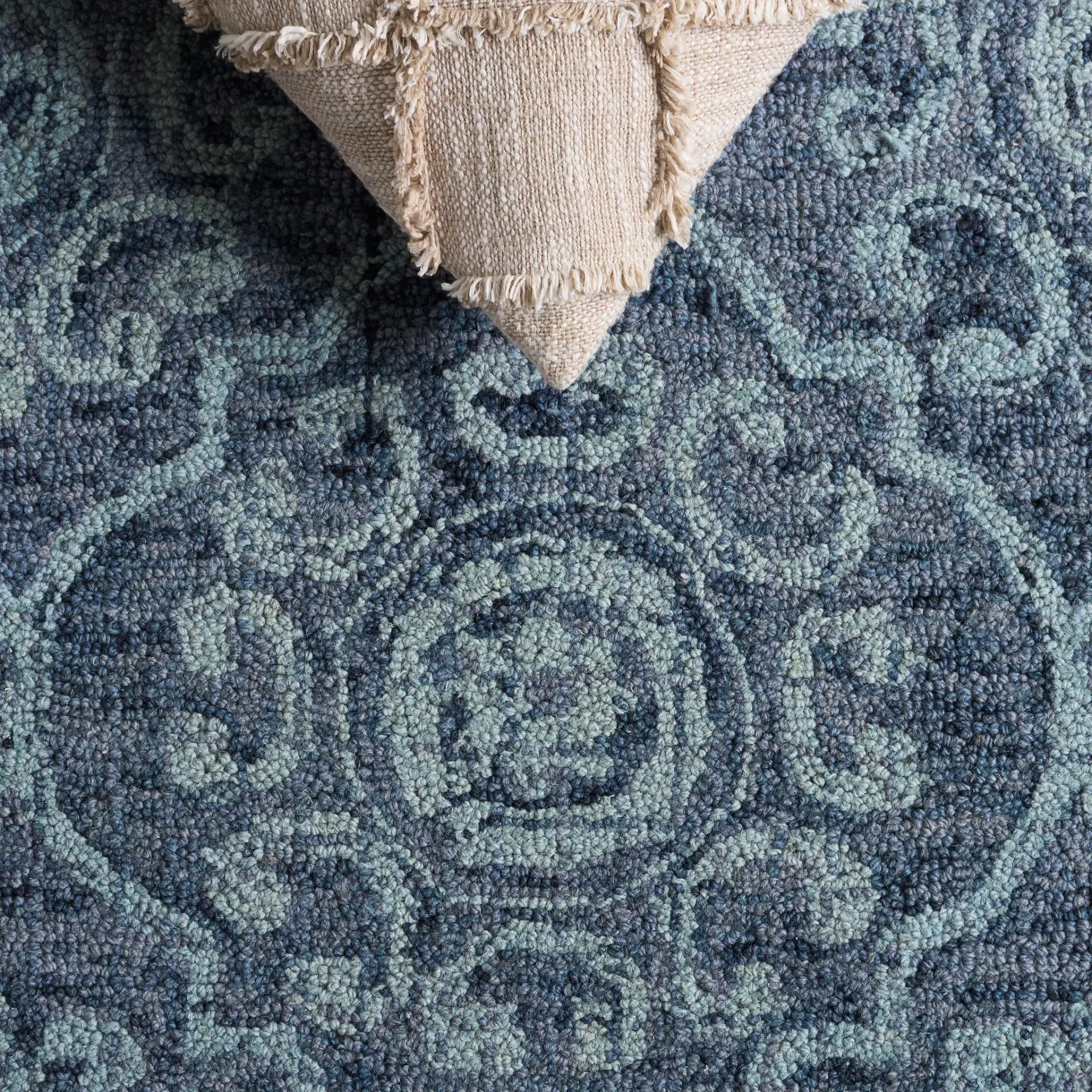 Abstract Transitional Allover Rosette Hand-Tufted Wool Rug in Blue in a styled room