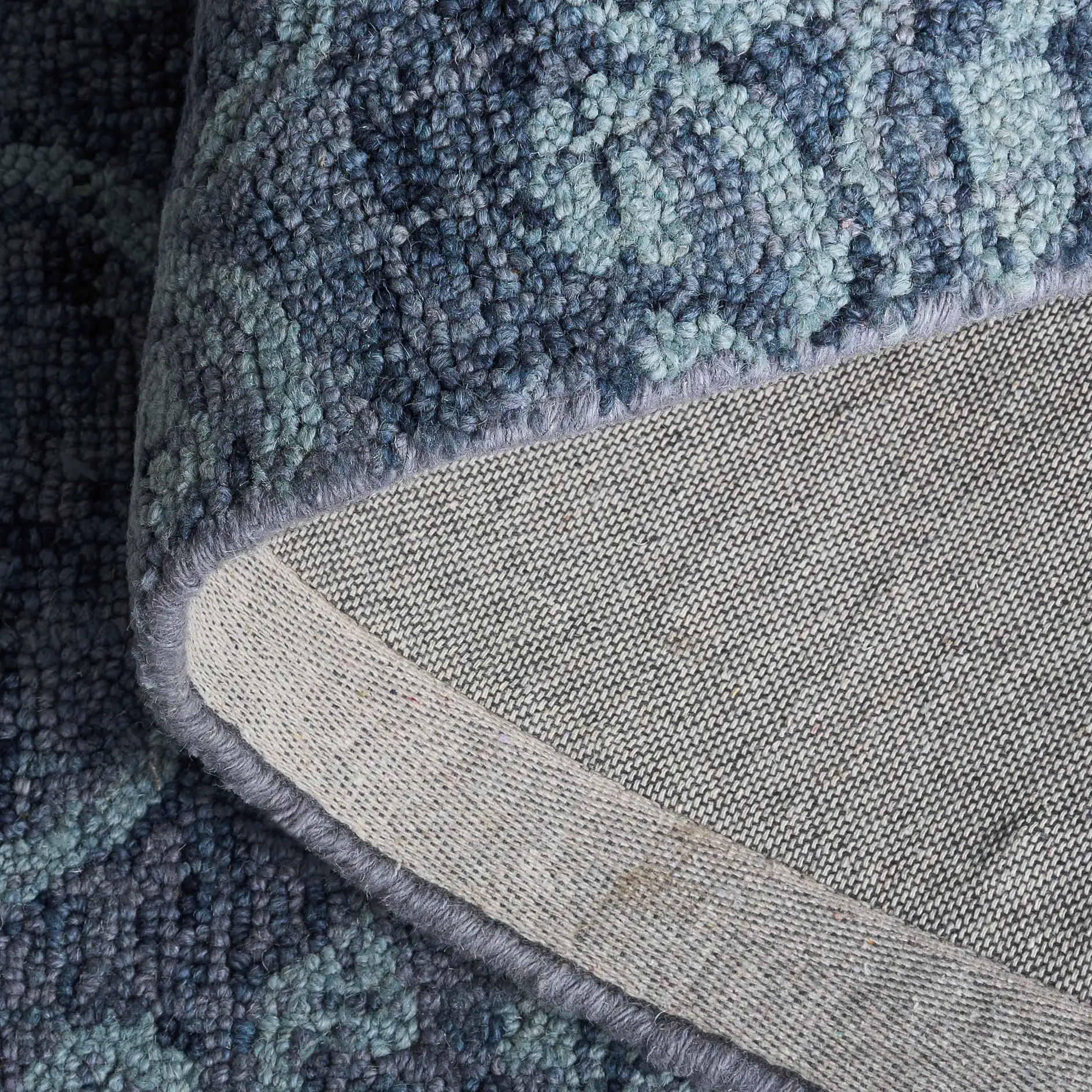Abstract Transitional Allover Rosette Hand-Tufted Wool Rug in Blue in a styled room
