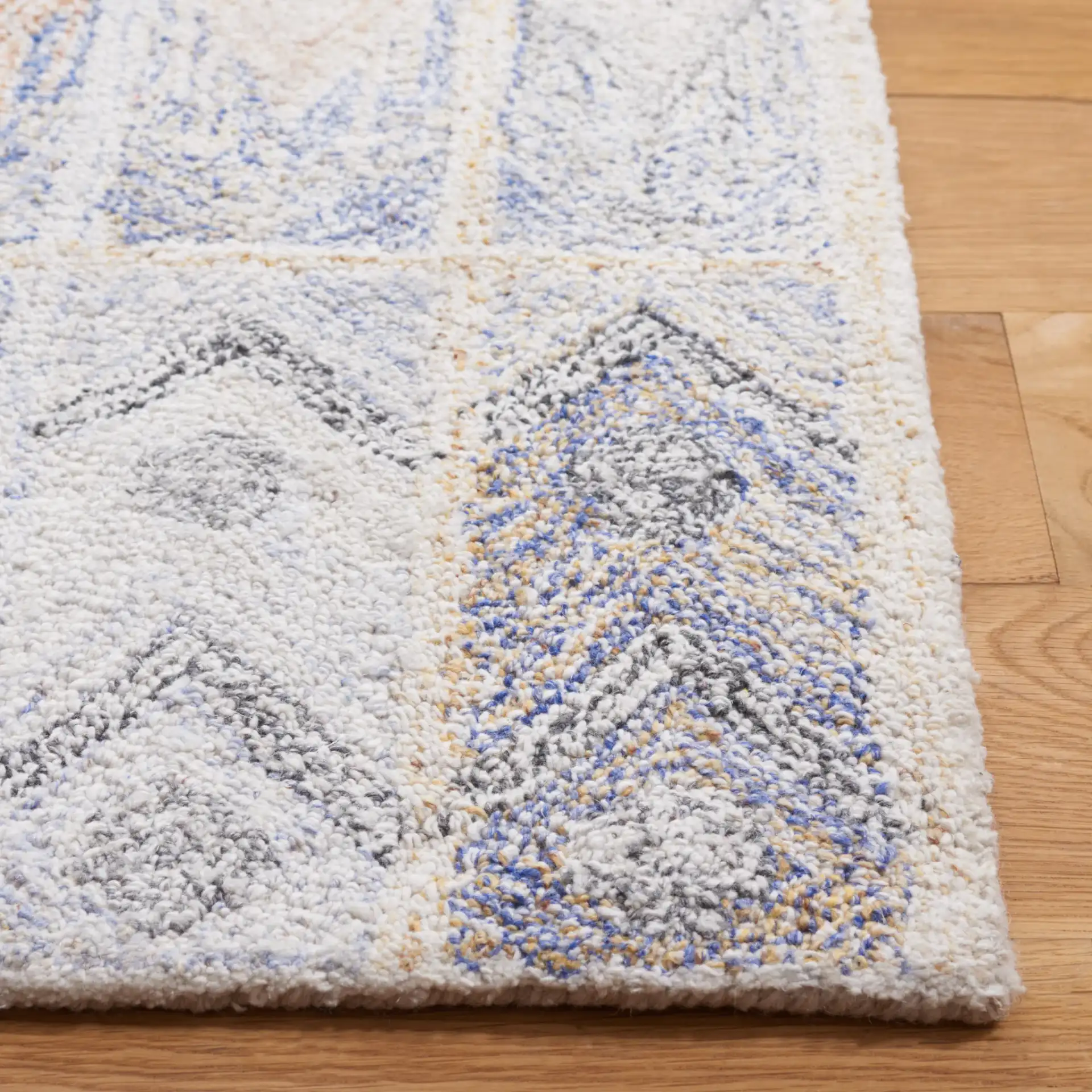 Abstract Bohemian Patchwork Hand-Tufted Rug in Blue / Rust in a styled room