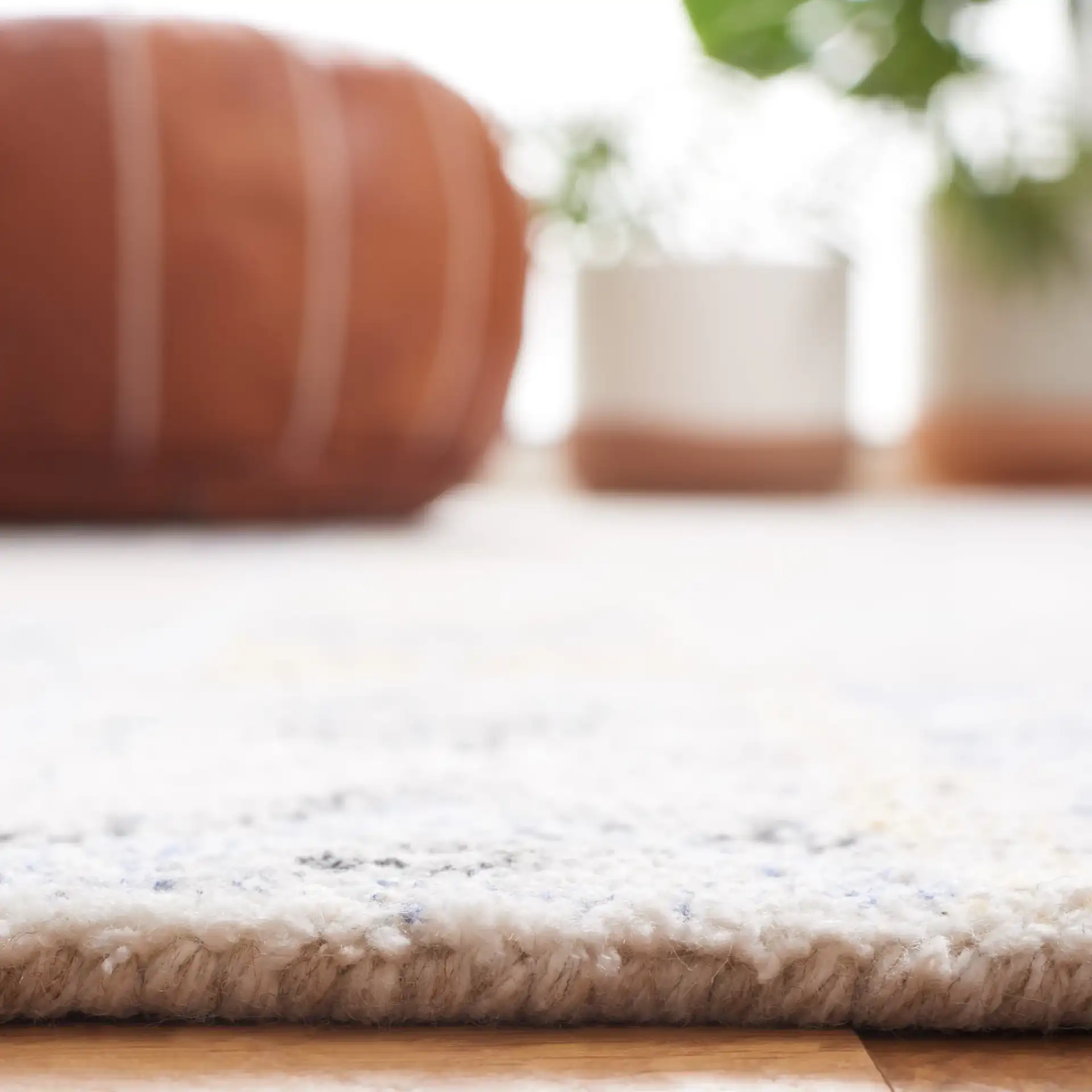 Abstract Bohemian Patchwork Hand-Tufted Rug in Blue / Rust in a styled room