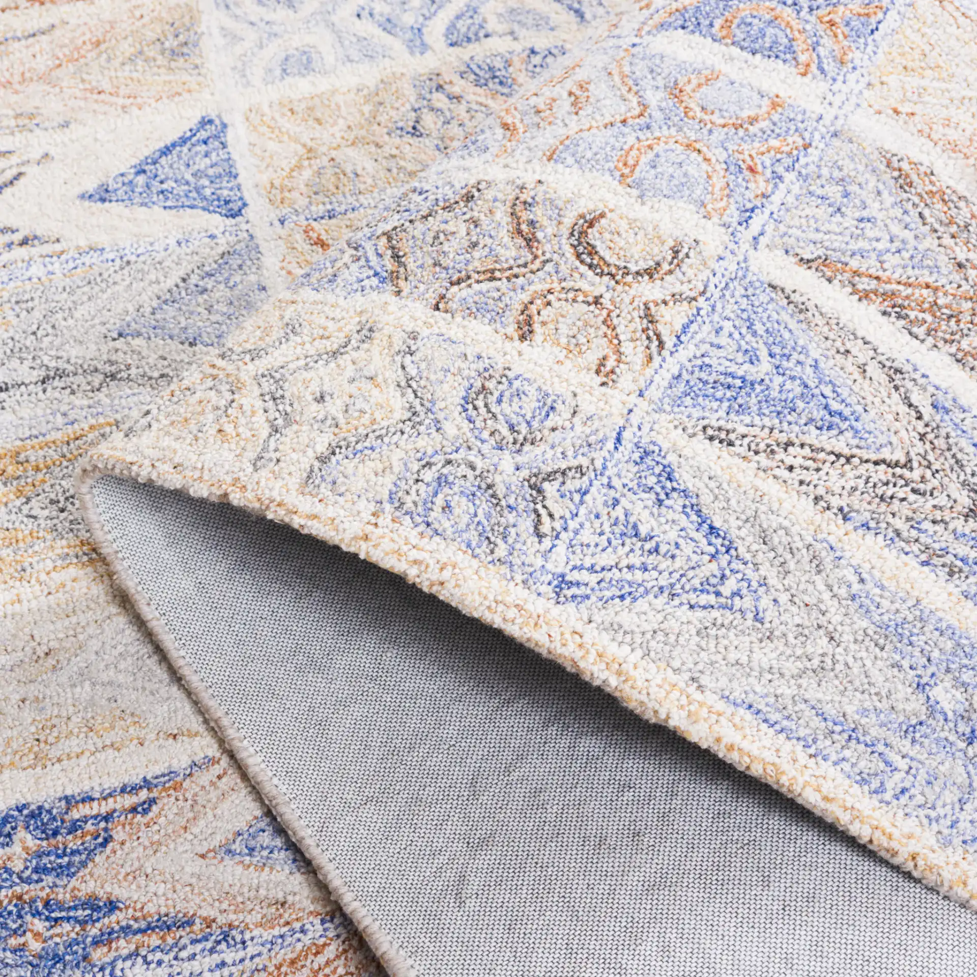 Abstract Bohemian Patchwork Hand-Tufted Rug in Blue / Rust in a styled room