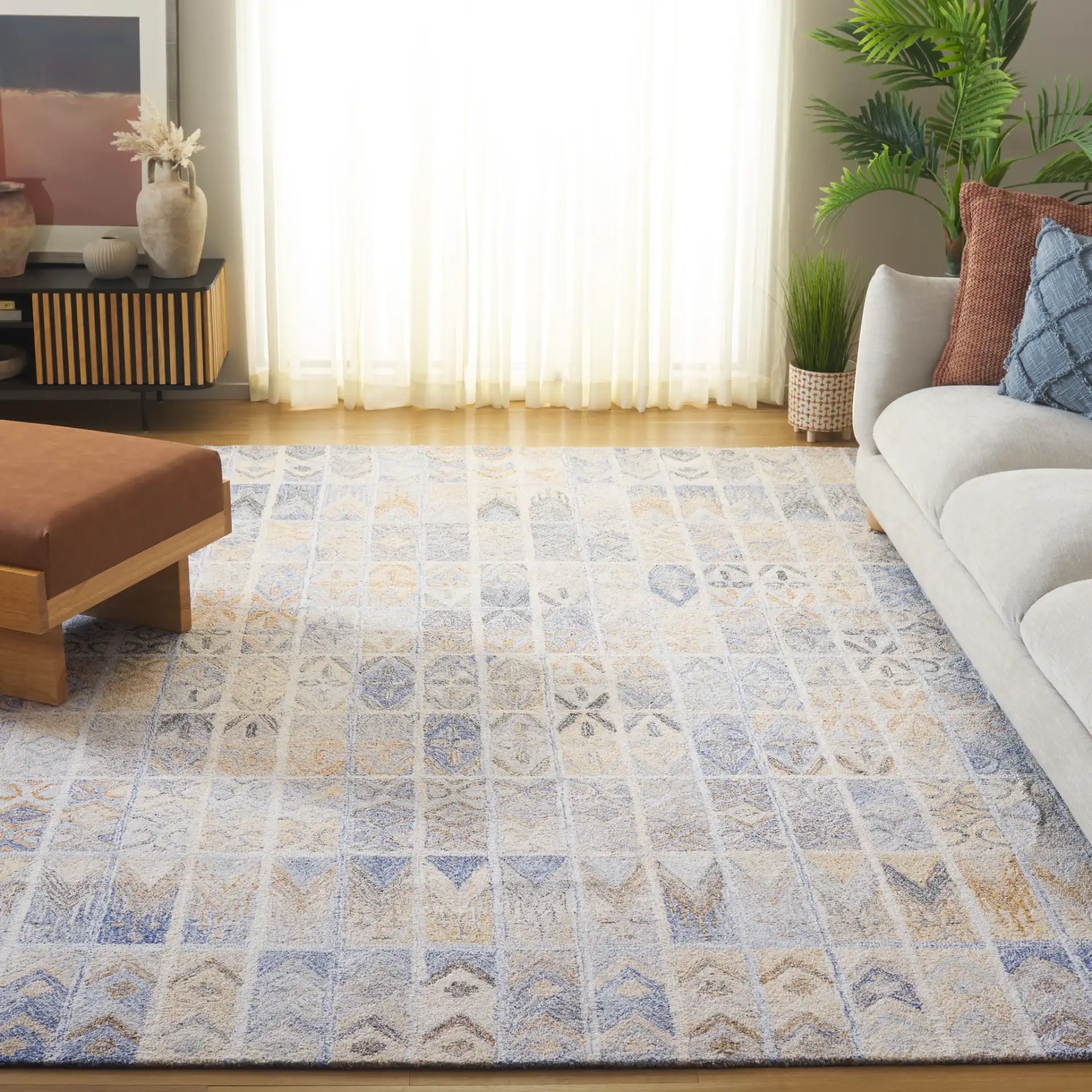 Abstract Bohemian Patchwork Hand-Tufted Rug in Blue / Rust in a styled room