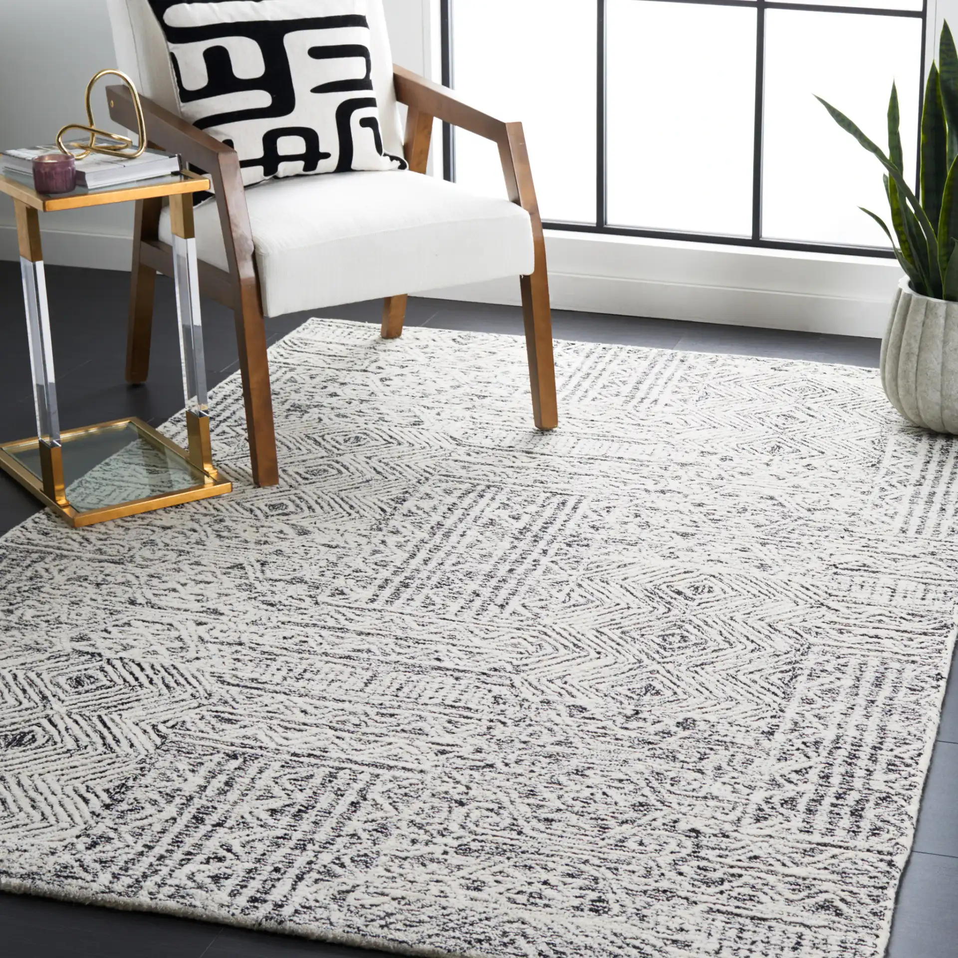 Abstract Boho Patchwork Hand-Tufted Wool Rug in Black / Ivory in a styled room