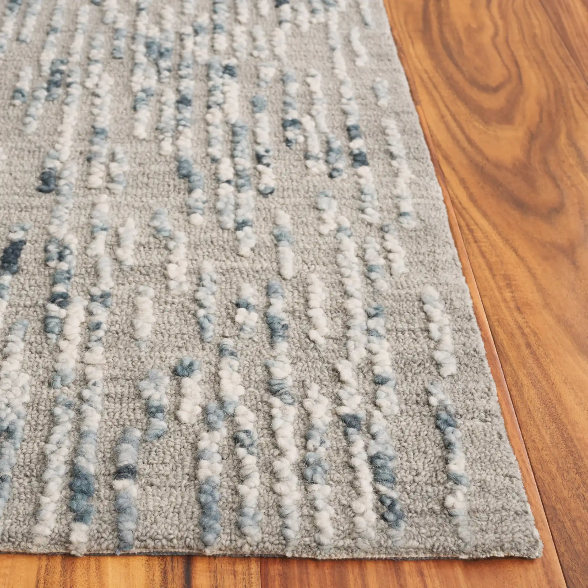 Abstract Dashed Stripe Hand-Tufted Wool Rug in Gray / Blue in a styled room