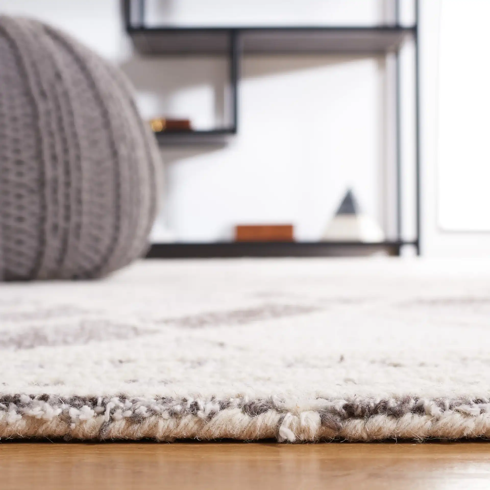 Abstract Boho Bordered Diamond Hand-Tufted Wool Rug in Ivory / Gray in a styled room