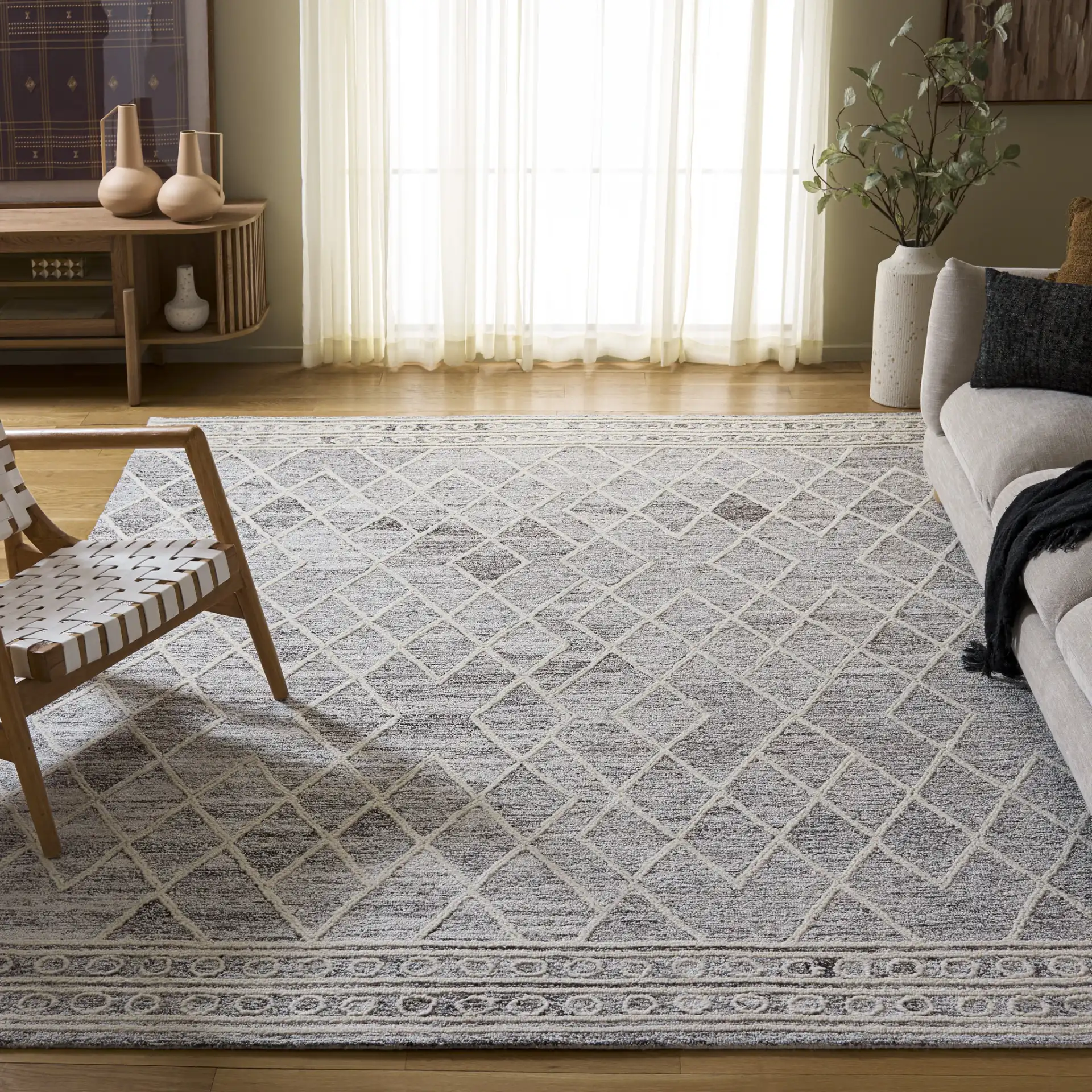 Abstract Boho Bordered Diamond Hand-Tufted Wool Rug in Ivory / Gray in a styled room