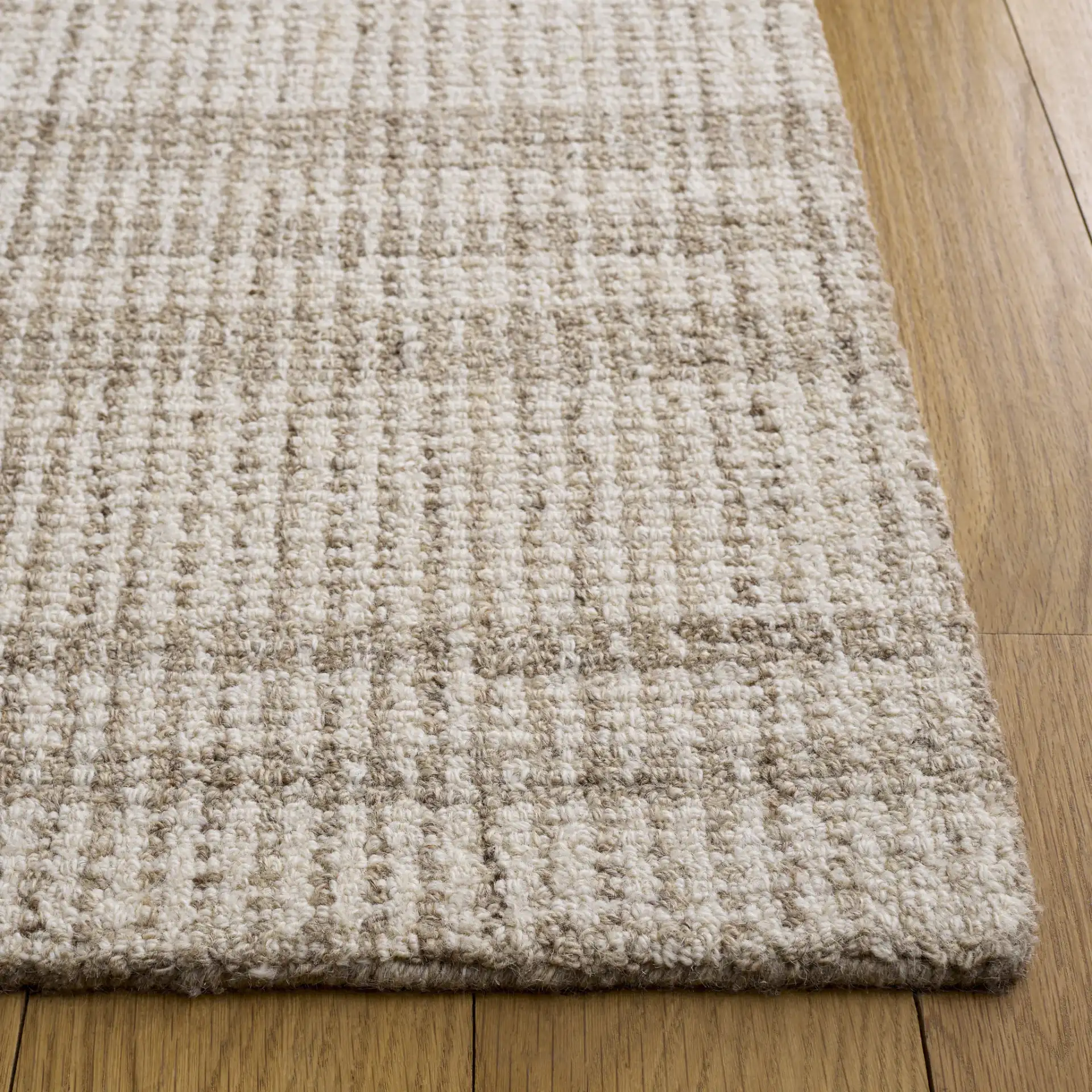 Abstract Plaid Hand-Tufted Wool Rug in Brown / Ivory in a styled room
