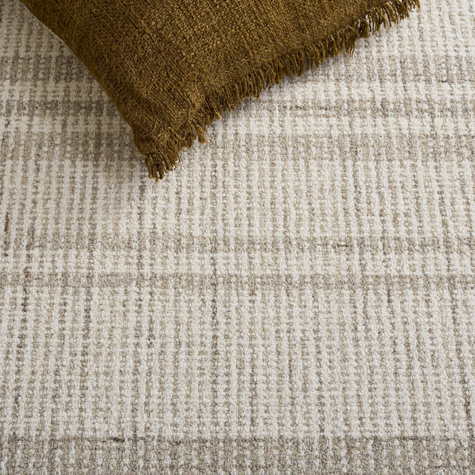 Abstract Plaid Hand-Tufted Wool Rug in Brown / Ivory in a styled room