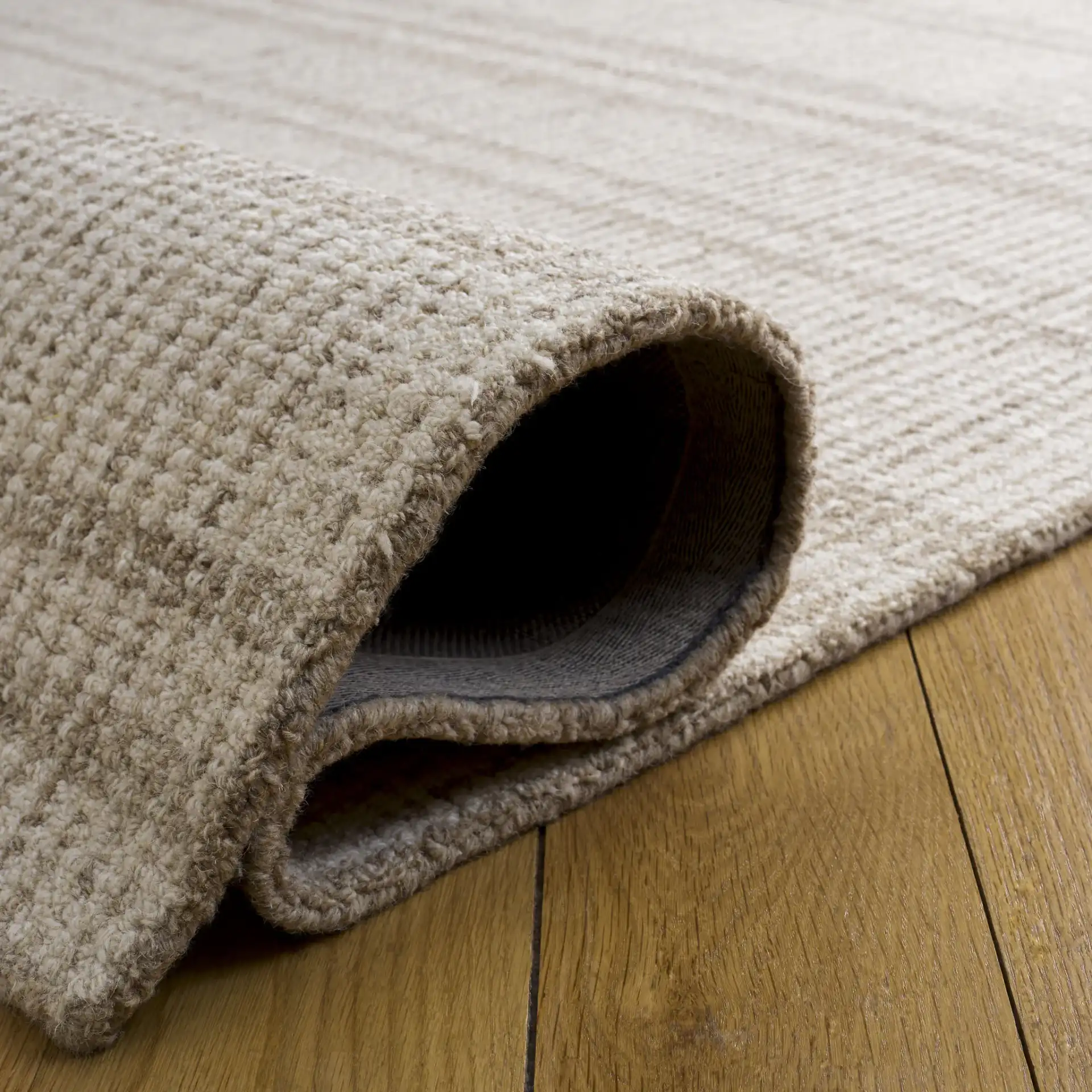 Abstract Plaid Hand-Tufted Wool Rug in Brown / Ivory in a styled room