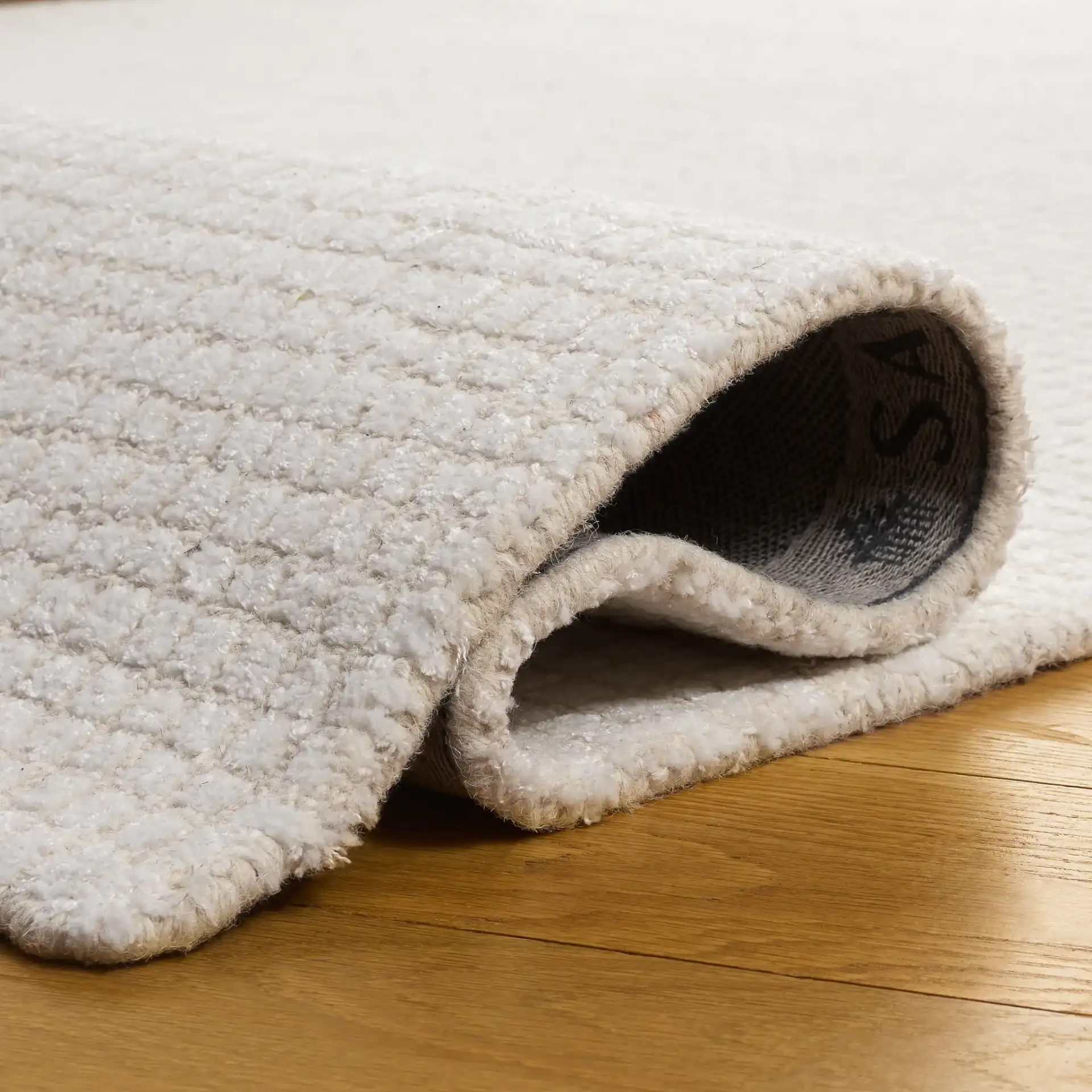 Abstract Solid Grid Hand-Tufted Rug in Ivory in a styled room