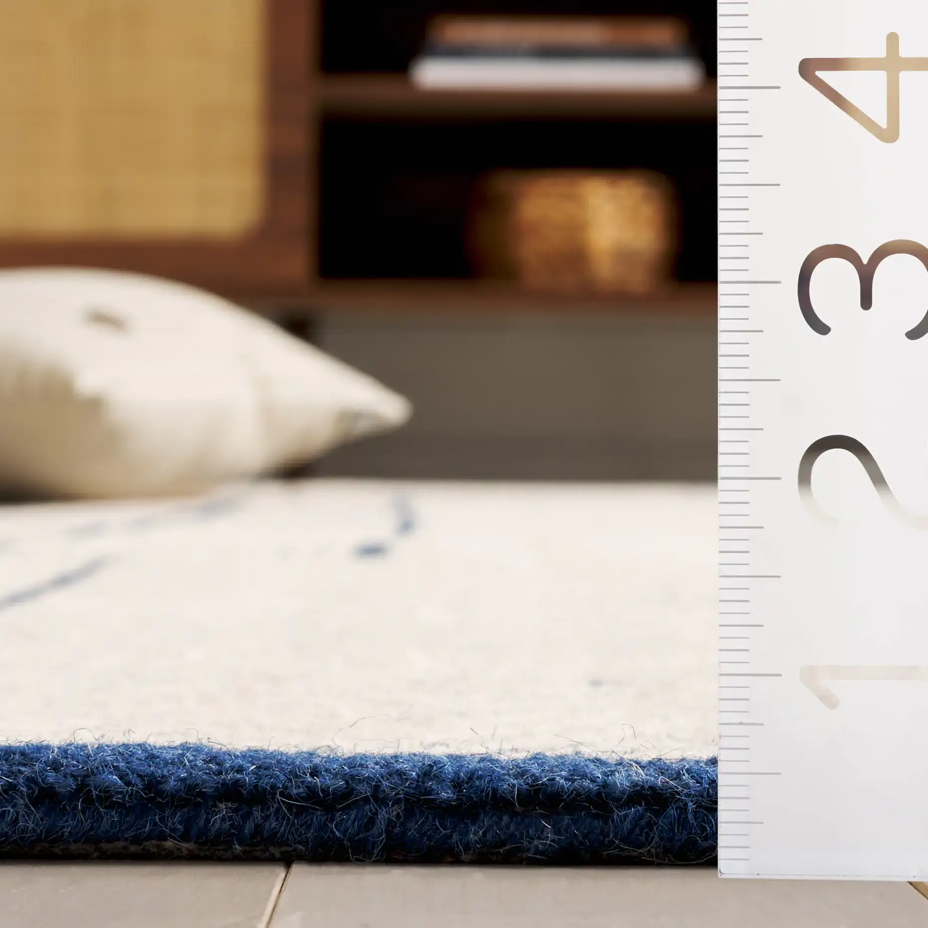 Abstract Patchwork Hand-Tufted Wool Rug in Ivory / Navy in a styled room