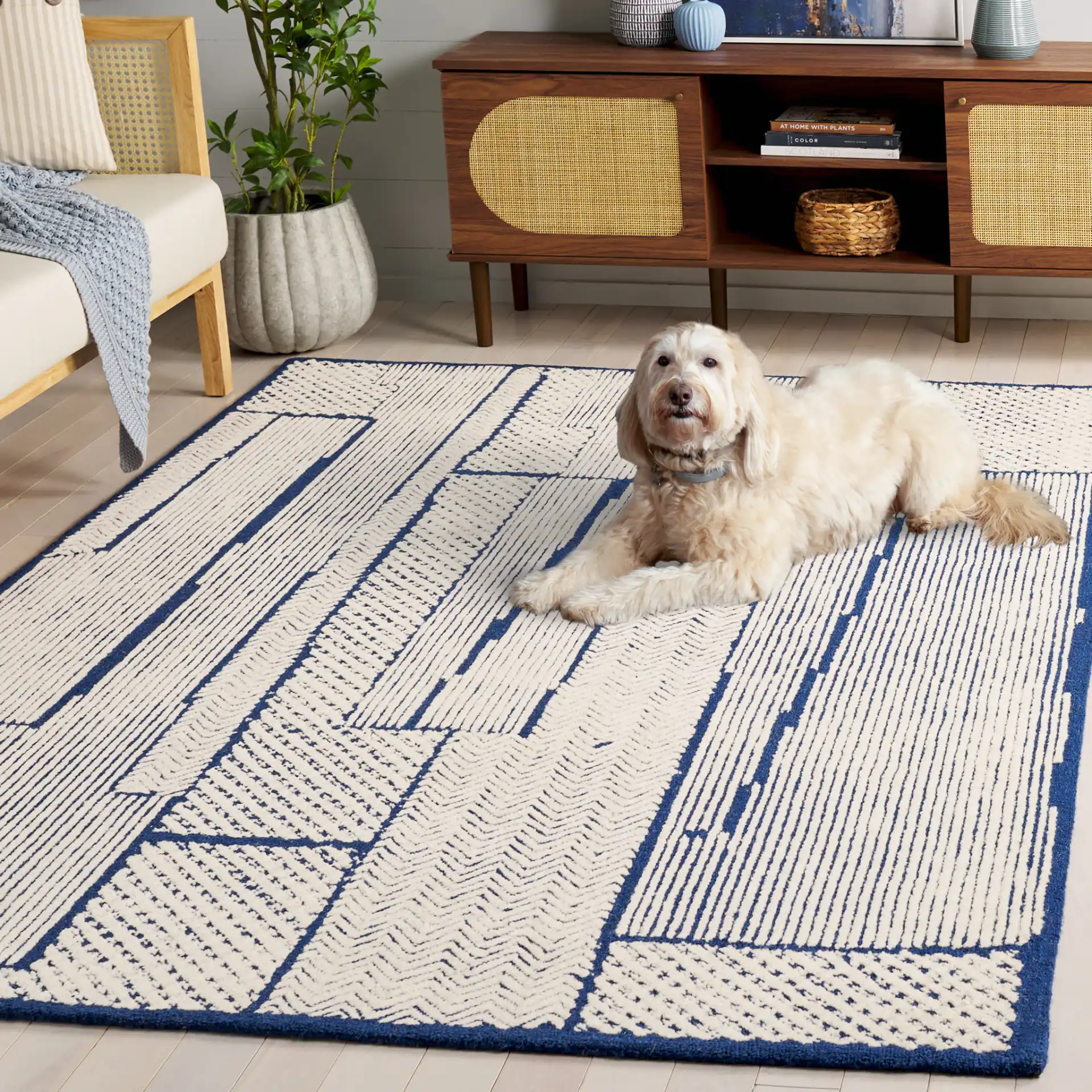 Abstract Patchwork Hand-Tufted Wool Rug in Ivory / Navy in a styled room