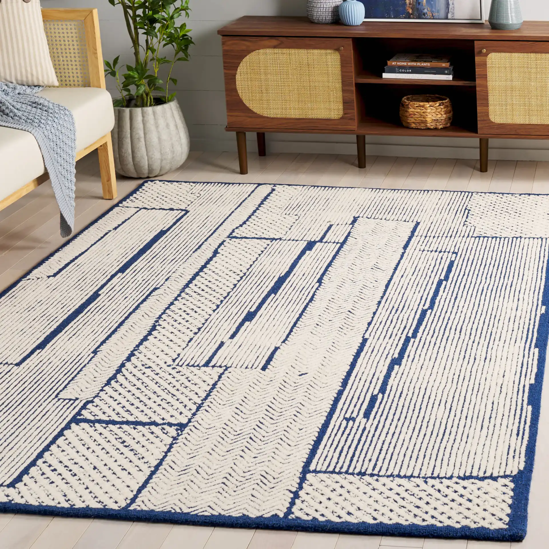Abstract Patchwork Hand-Tufted Wool Rug in Ivory / Navy in a styled room