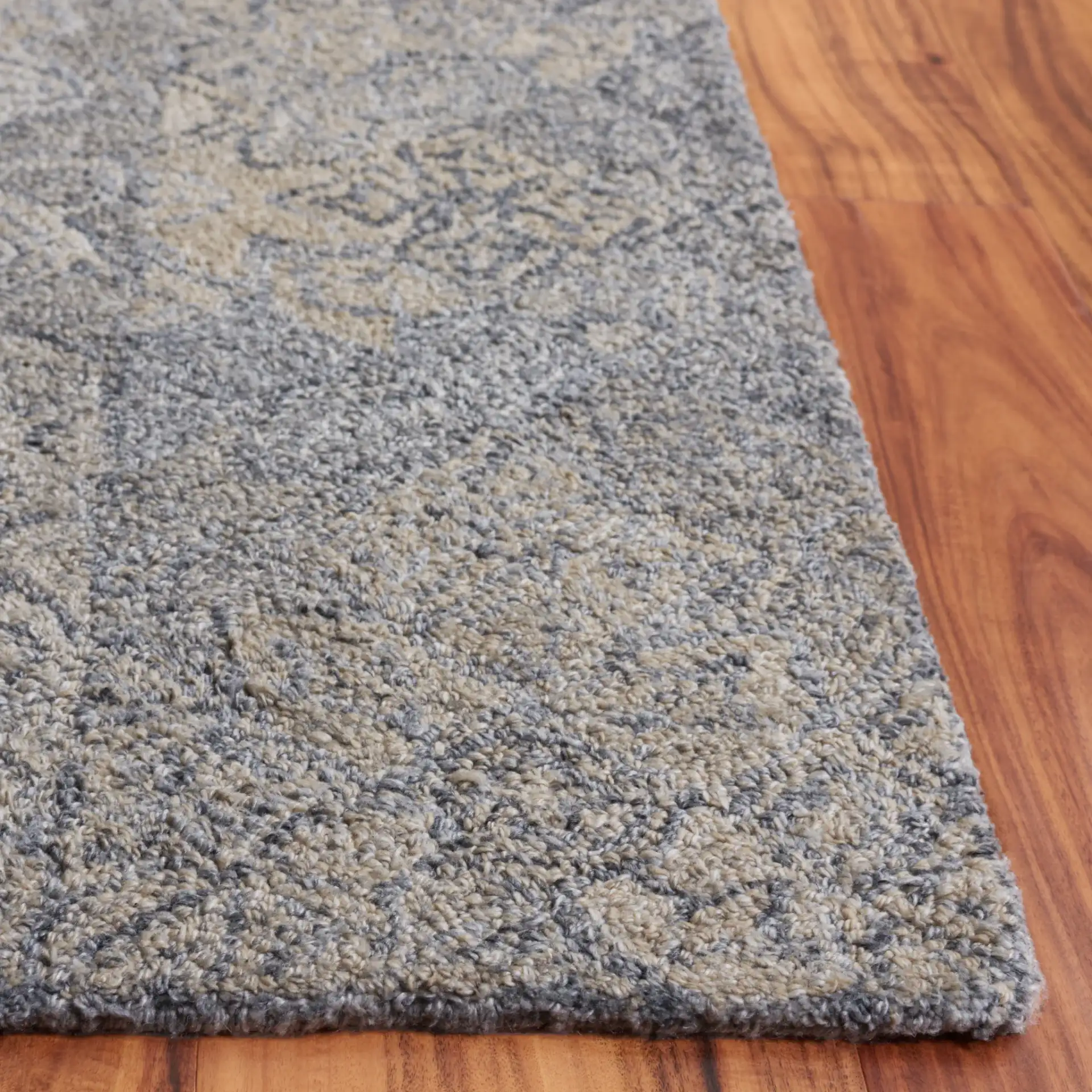 Abstract Transitional Distressed Hand-Tufted Rug in Beige / Gray in a styled room