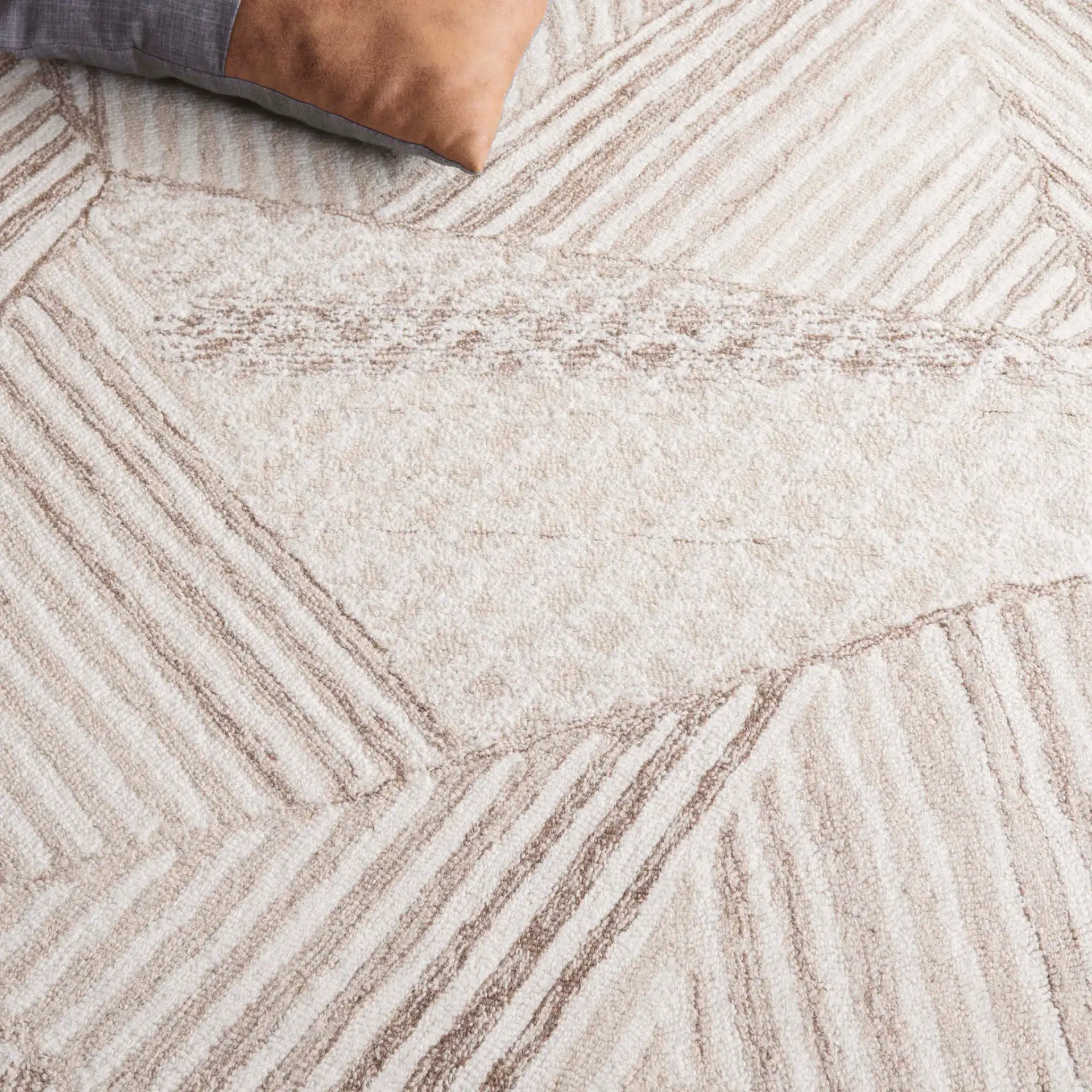 Abstract Abstract Geometric Patchwork Hand-Tufted Wool Rug in Ivory / Light Brown in a styled room