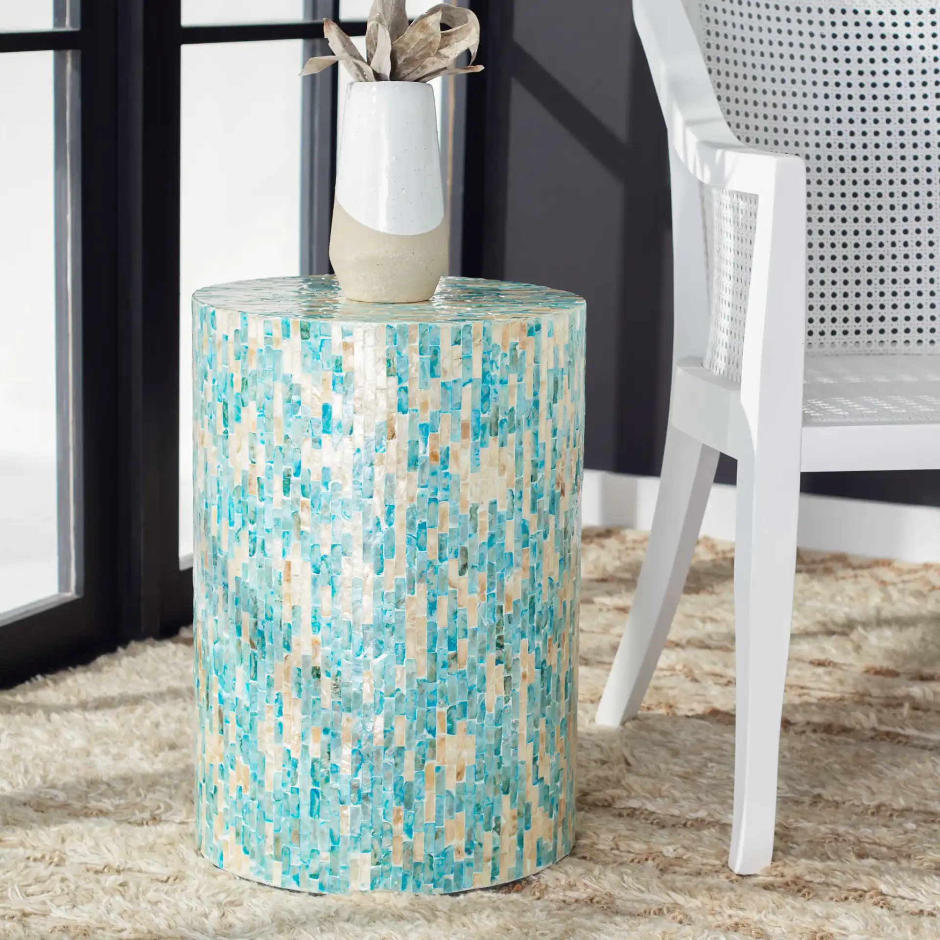 Presley Round Accent Table in Blue / Gold in a styled room