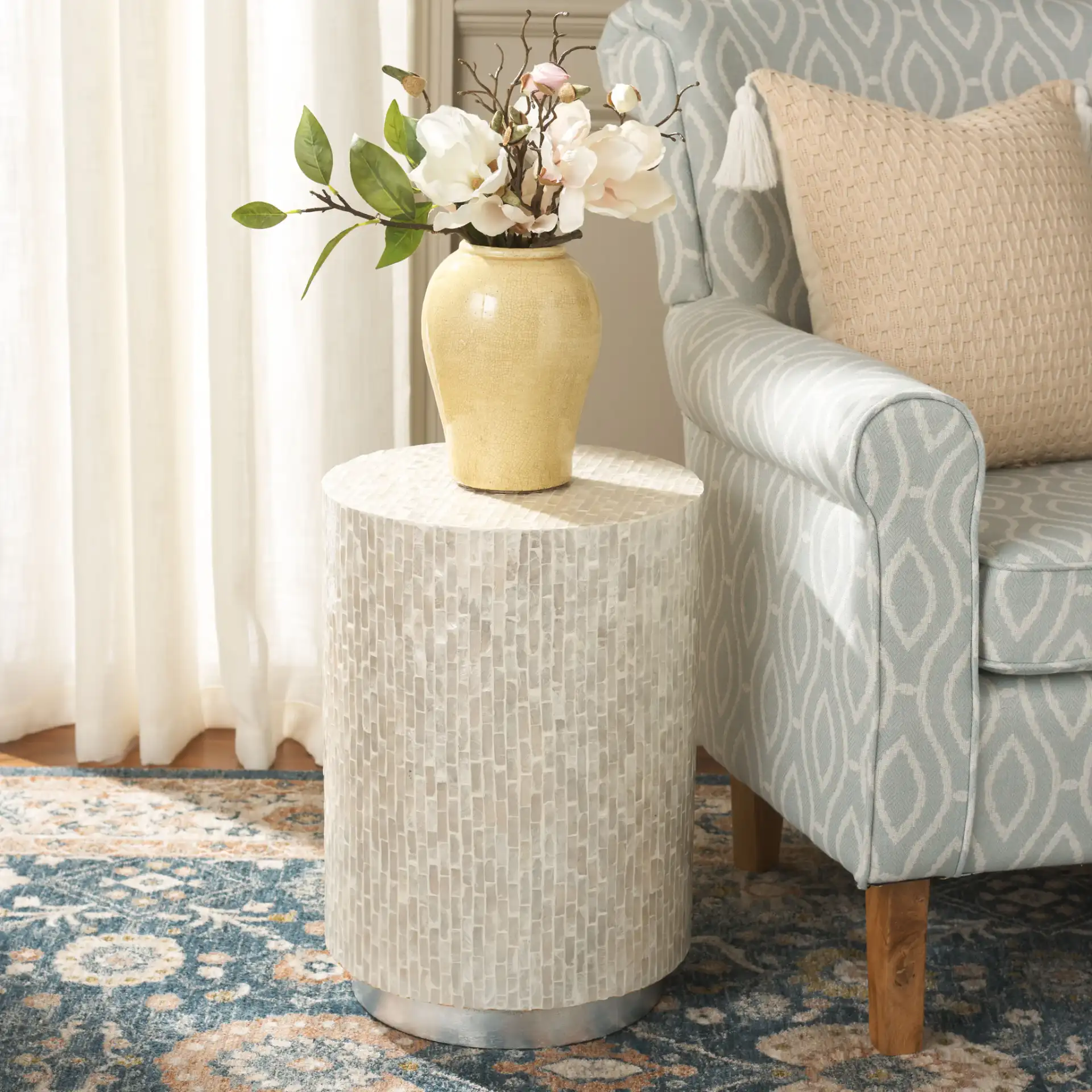 Scarlett Round Accent Table in Natural / Silver in a styled room
