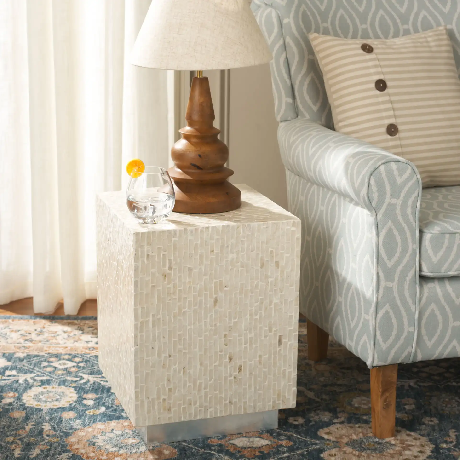 Scarlett Square Accent Table in Natural / Silver in a styled room