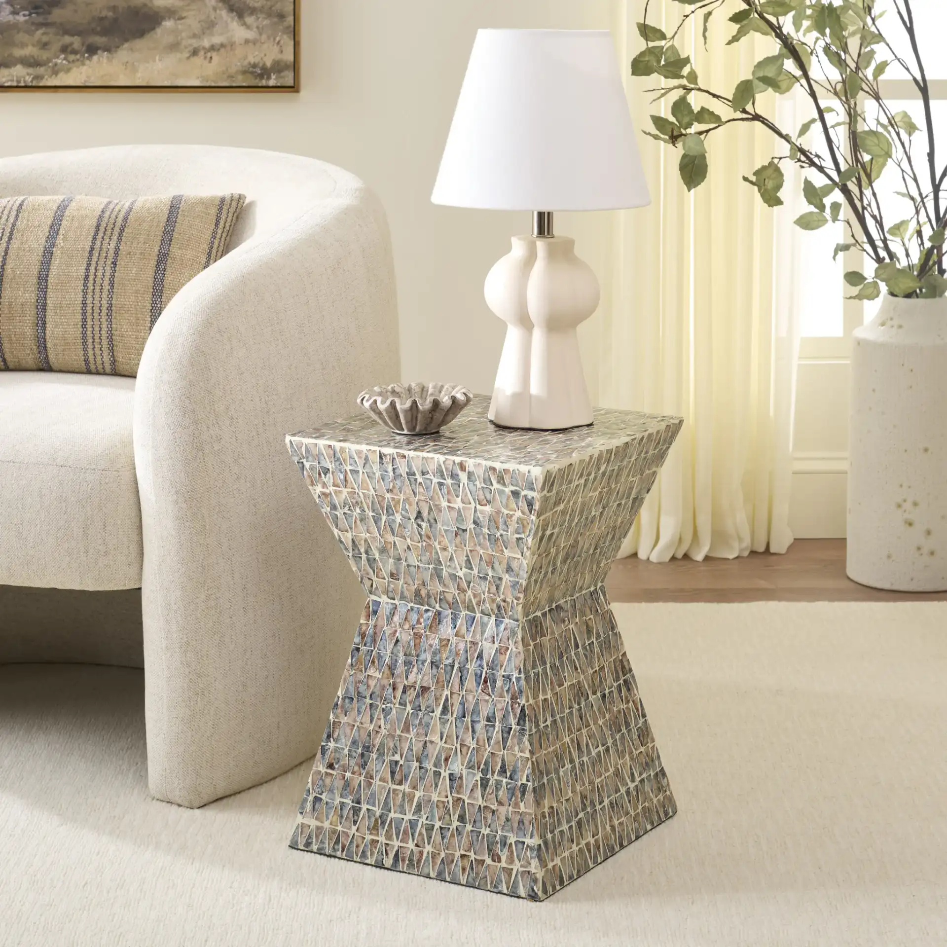 Nakisha Accent Table in Gray / Brown in a styled room