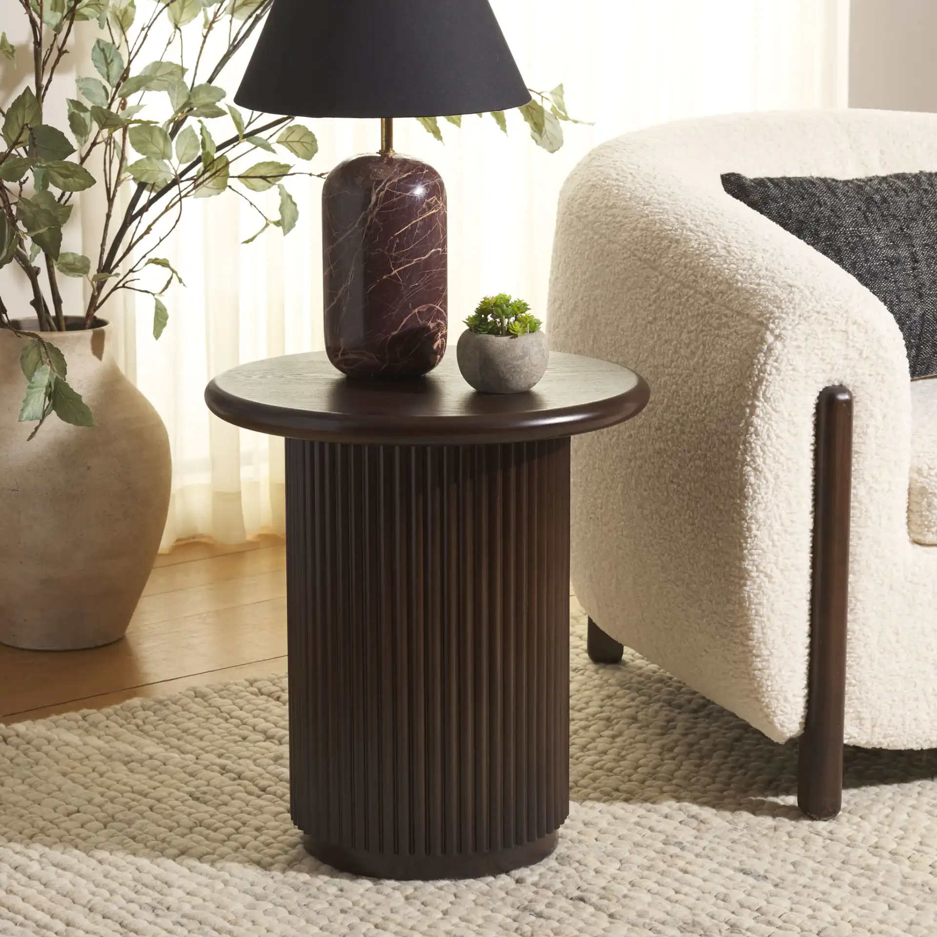 Agami Round Accent Table in Dark Brown in a styled room