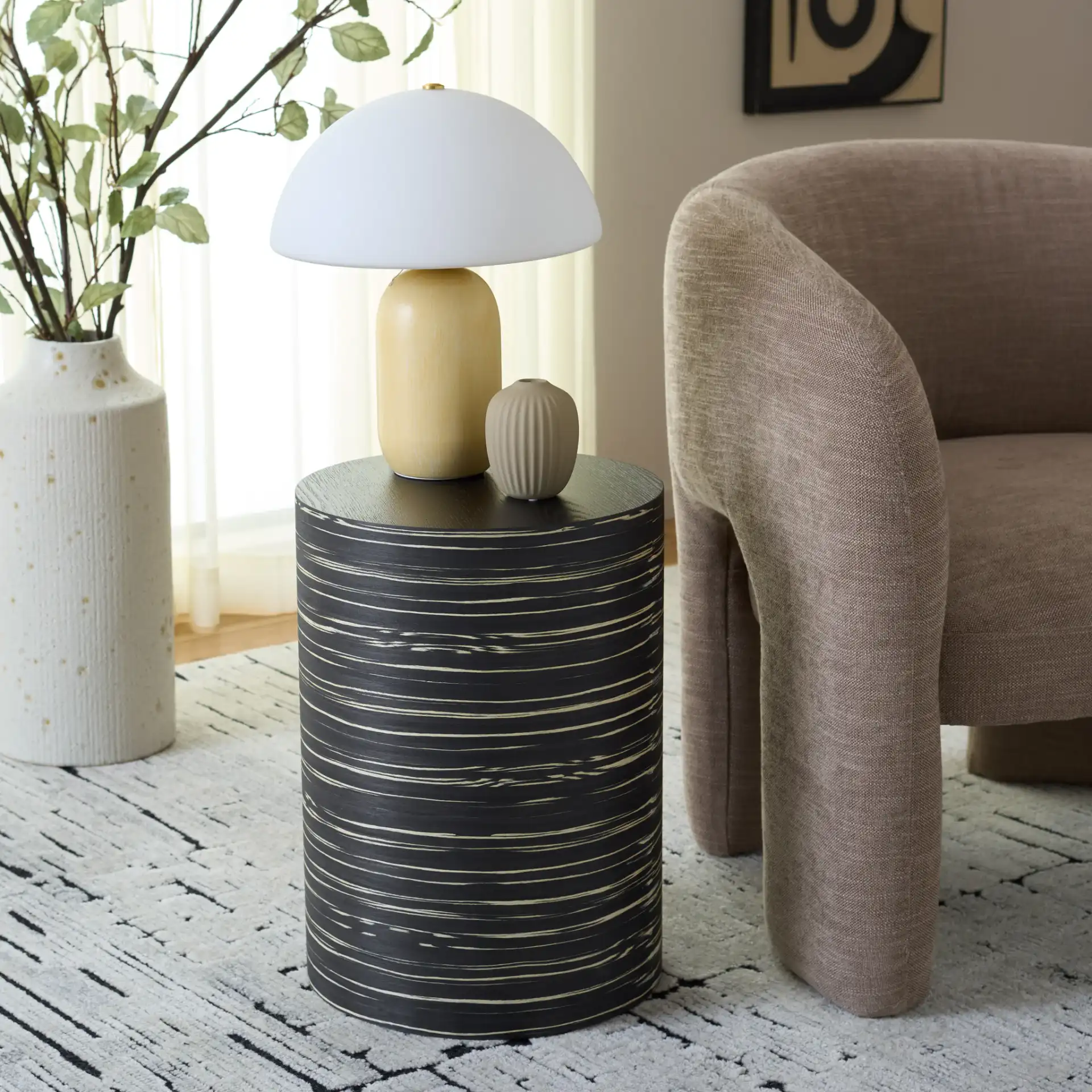 Bahan Round End Table in Black in a styled room