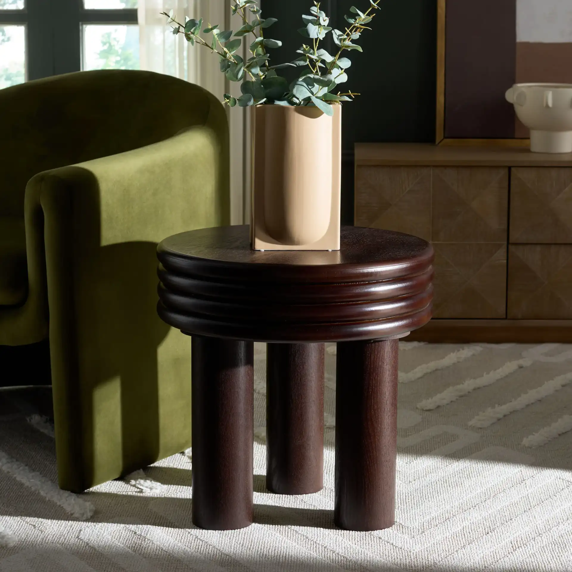 Ohana Accent Table in Dark Brown in a styled room