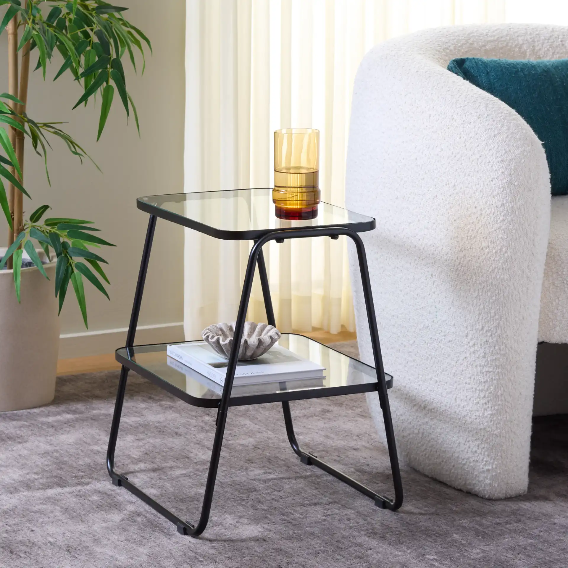 Zunia Two-Tier Accent Table in Black in a styled room