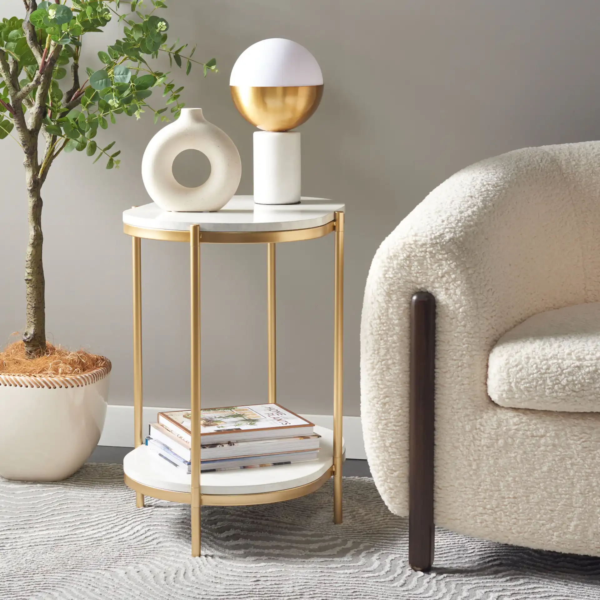 Dove End Table in White Faux Marble / Gold in a styled room