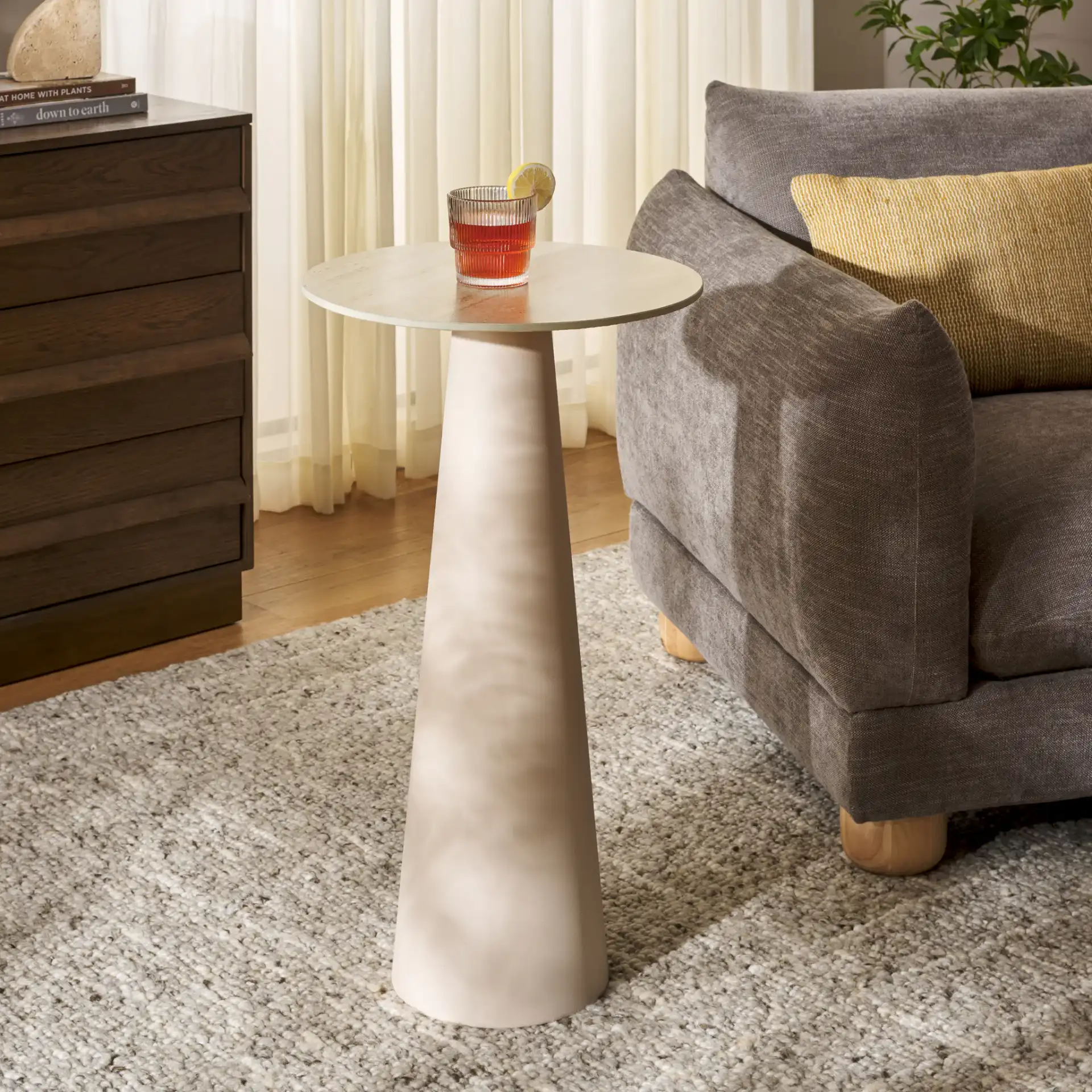 Nurem Tall Ceramic Side Table in Beige Ceramic / Beige in a styled room