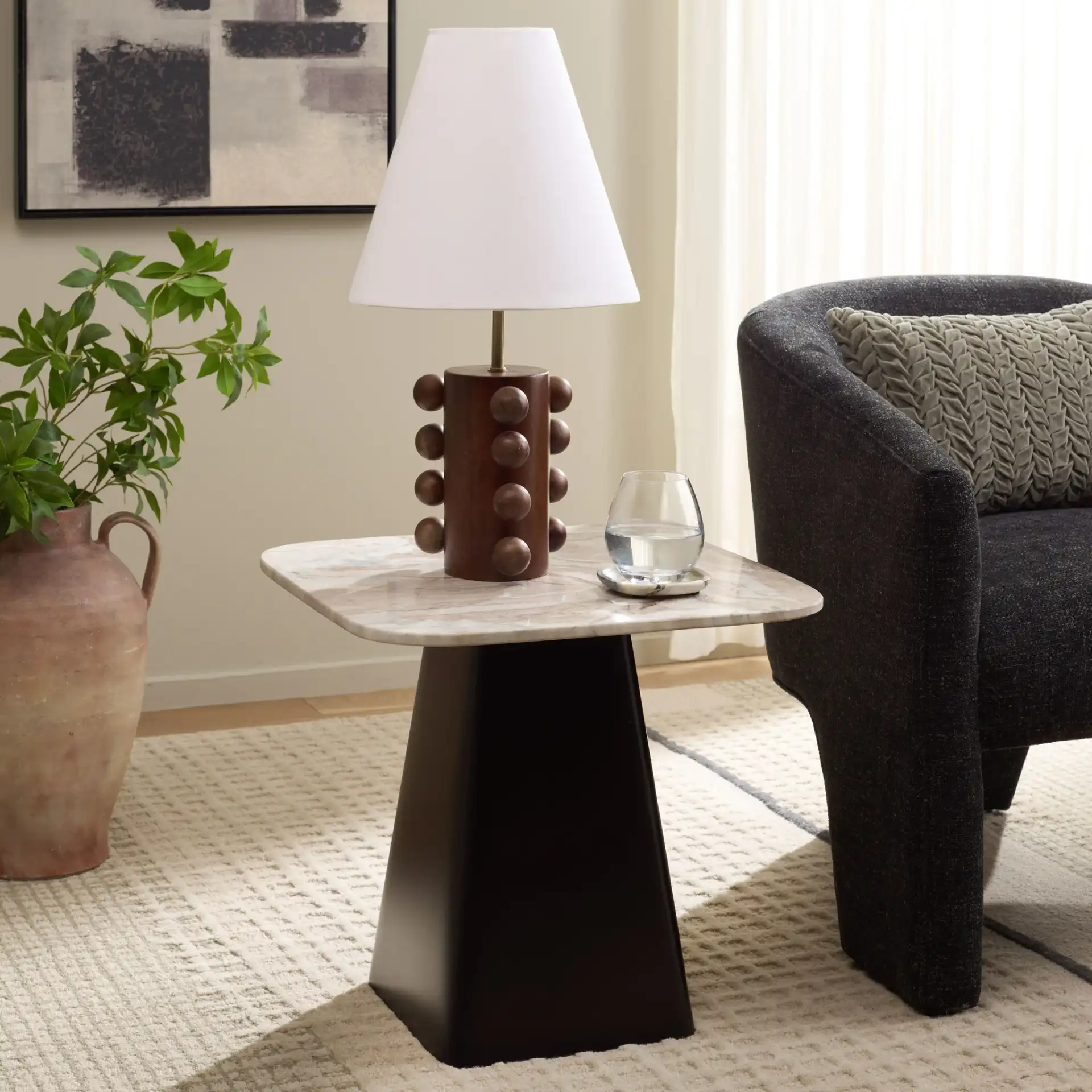 Tecia Marble Side Table in Brown / White / Black in a styled room