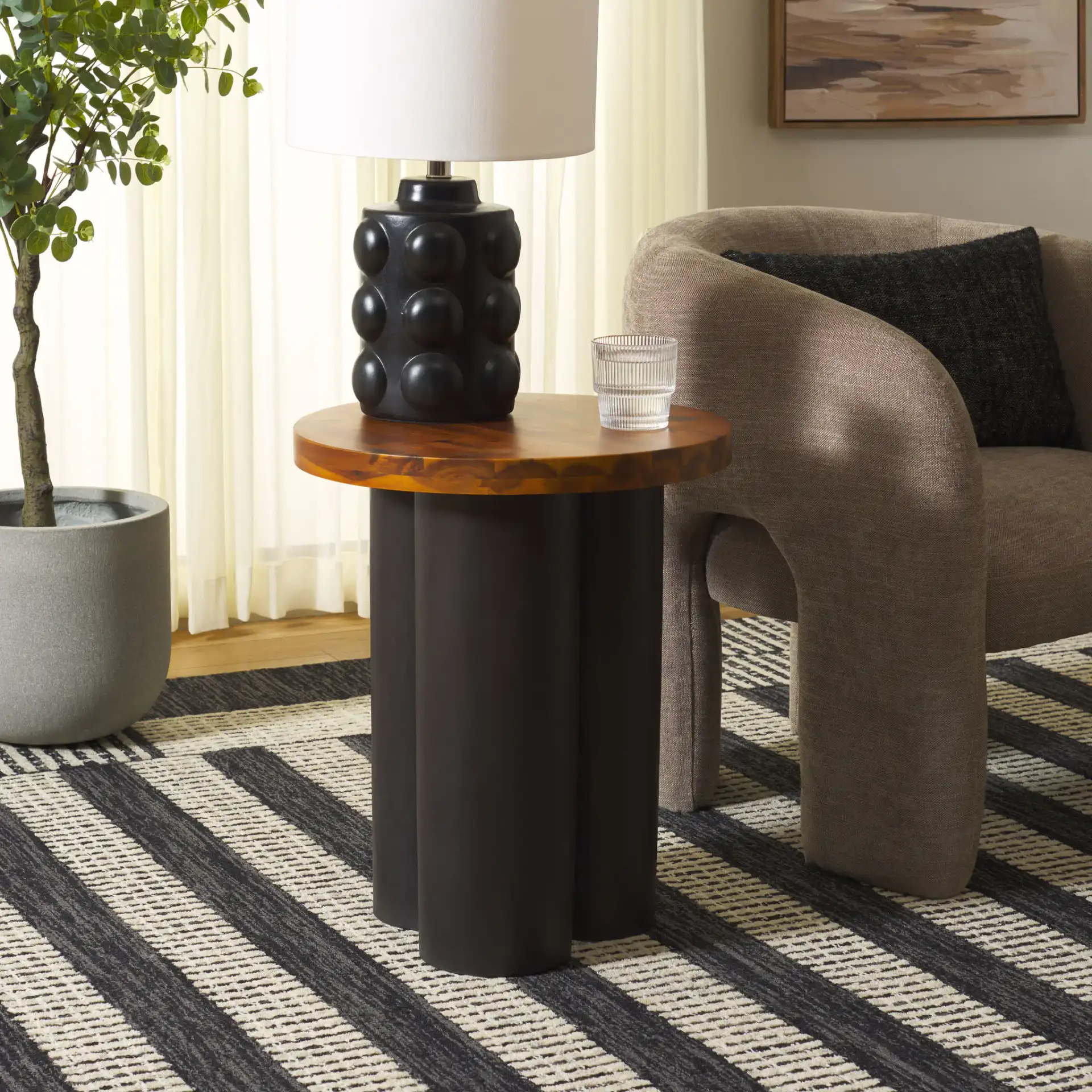 Benvolio Accent Table in Natural / Charcoal in a styled room