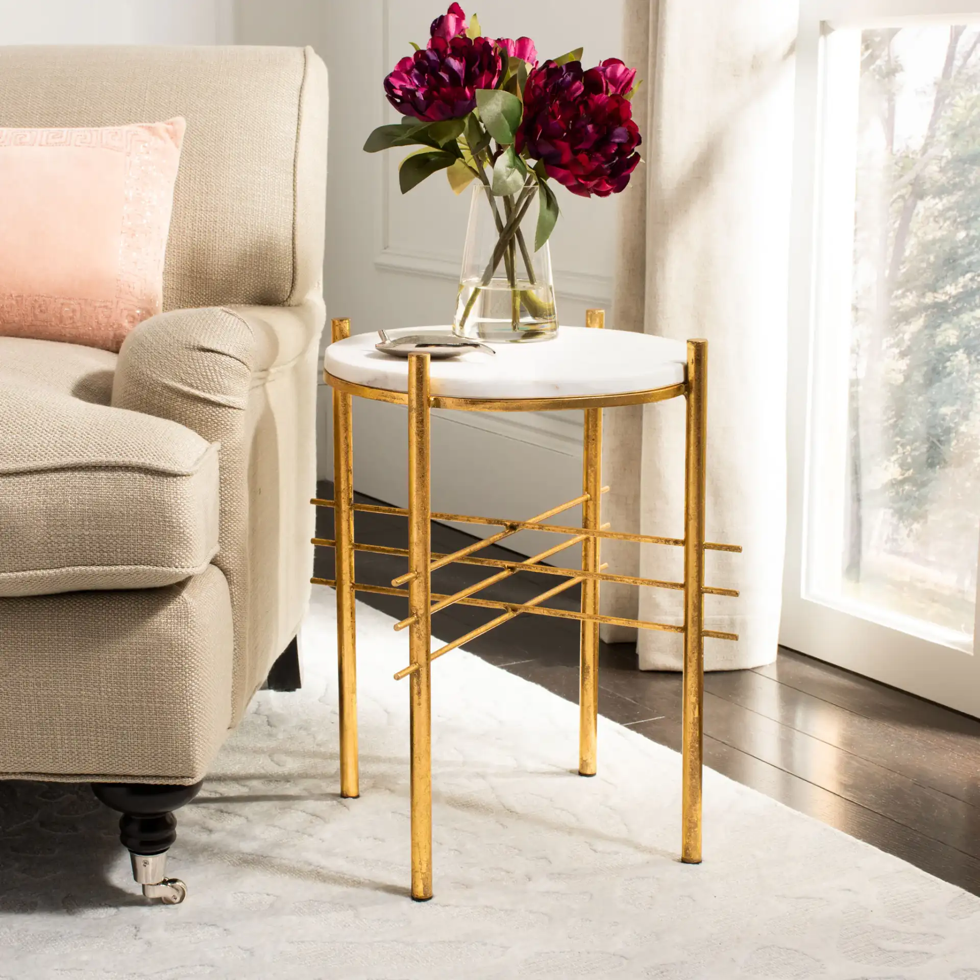 Jenesis Round Accent Table in White Marble / Gold in a styled room