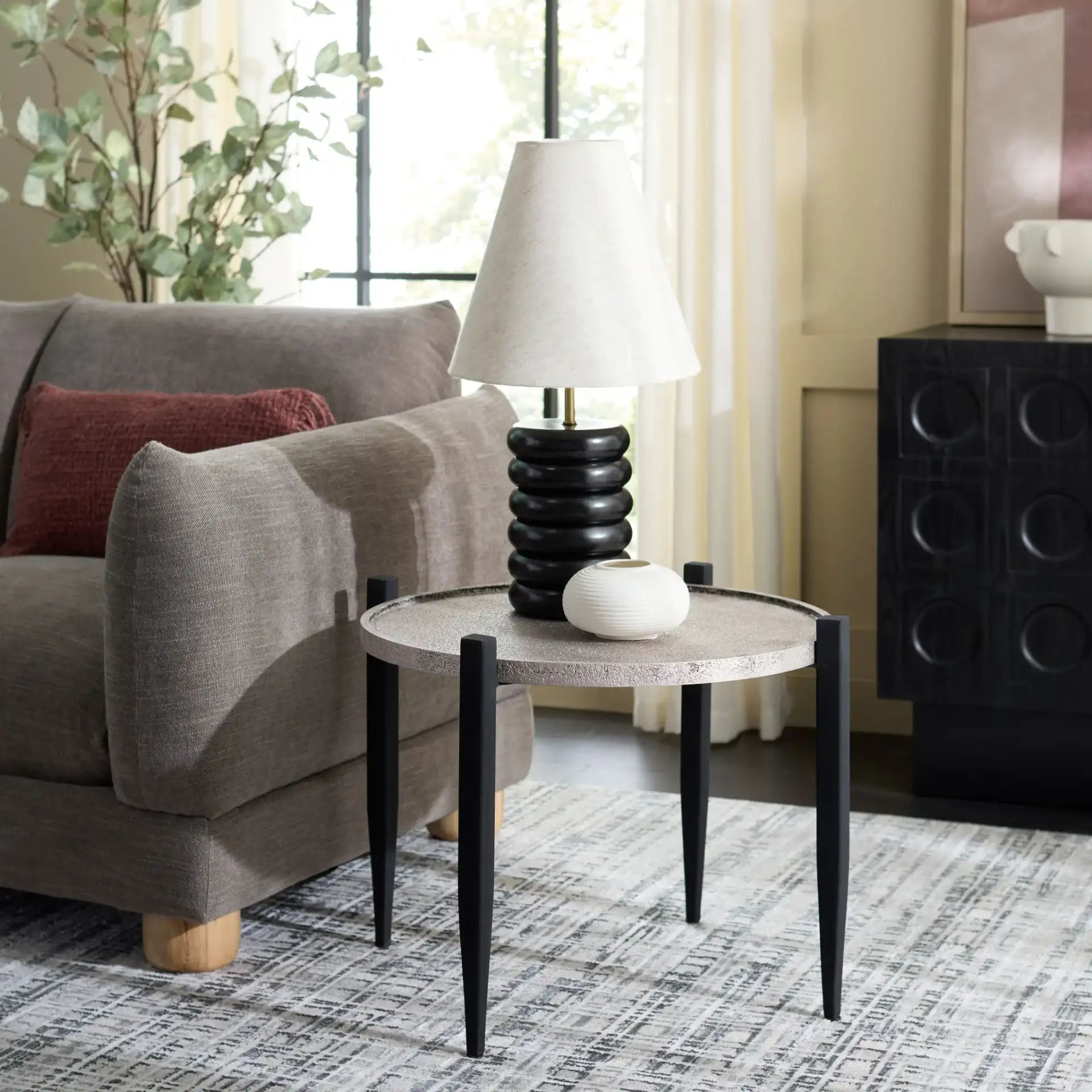 Ringo Accent Table in Gray / Black in a styled room