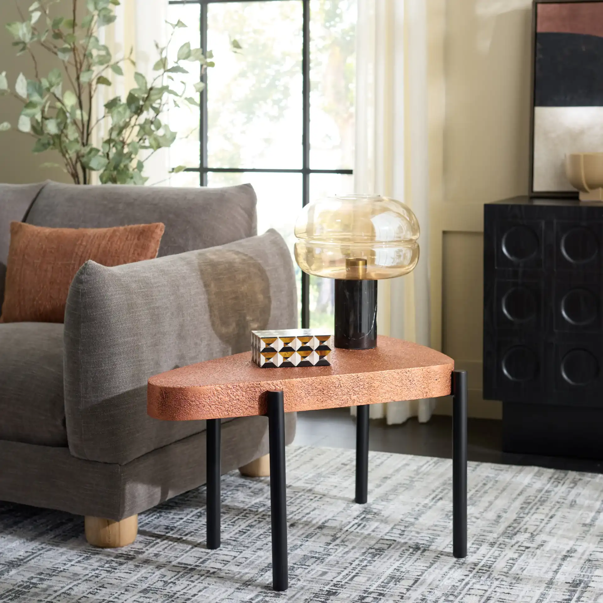 Sado Accent Table in Brown / Black in a styled room