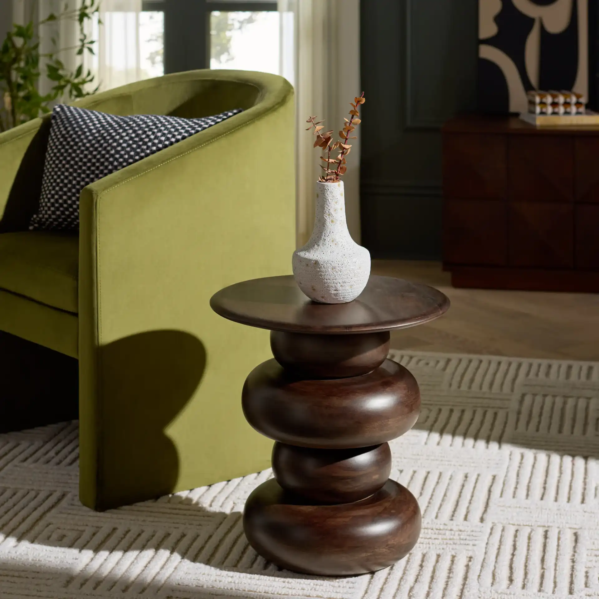 Nube Round Accent Table in Dark Brown in a styled room