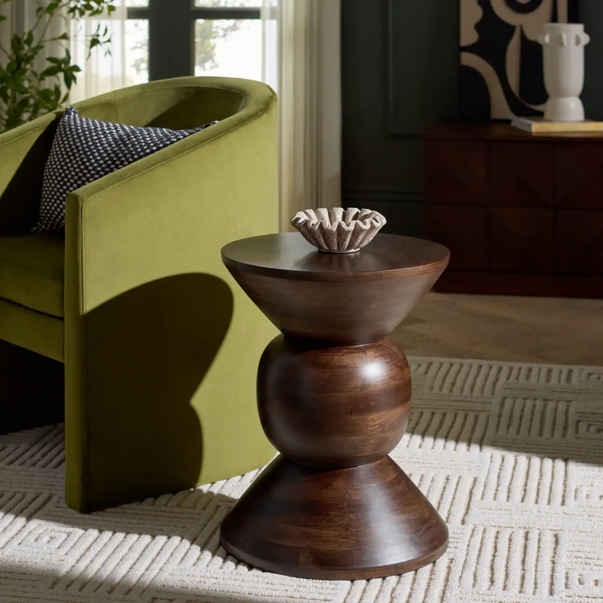 Pascual Round Accent Table in Walnut in a styled room