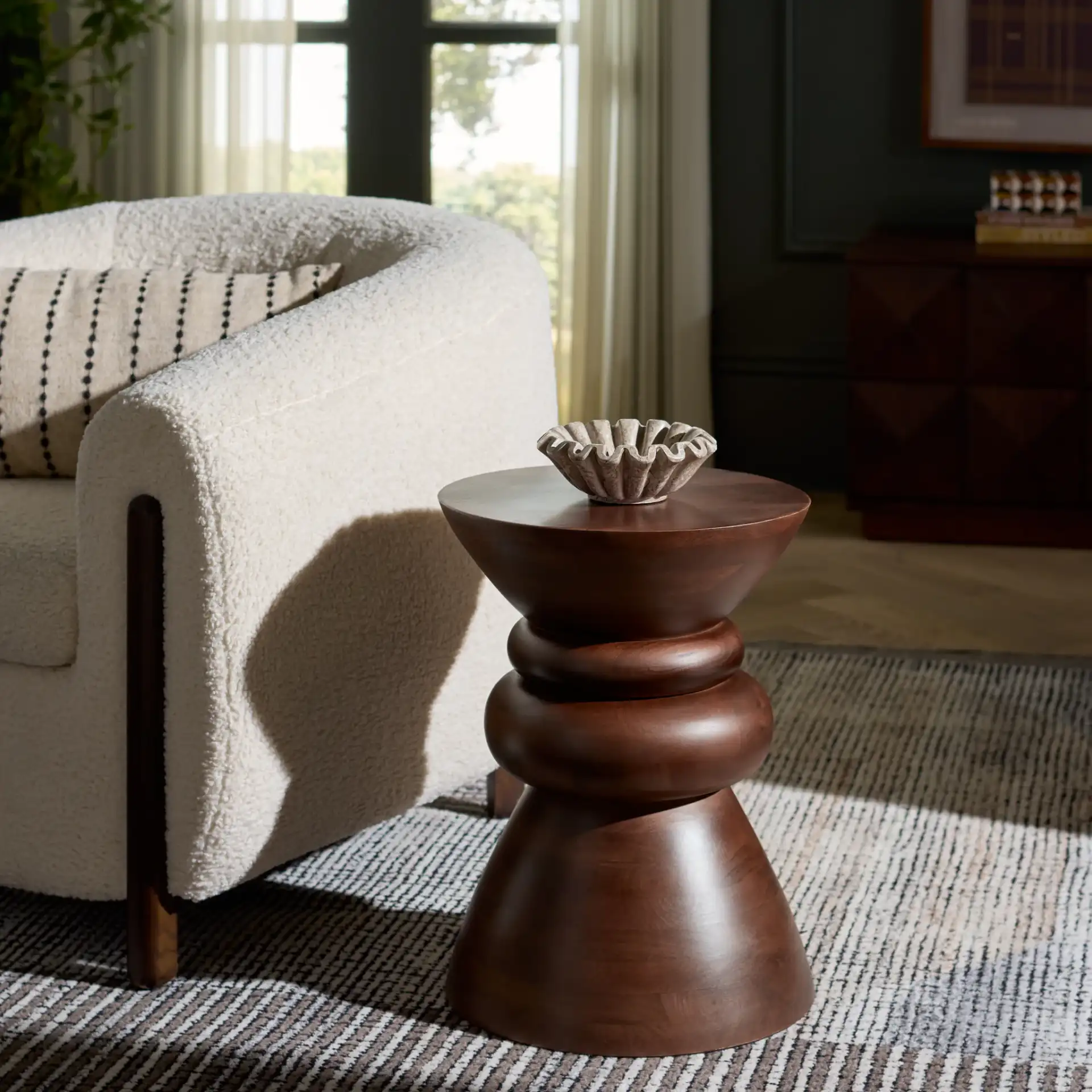 Ignacio Round Accent Table in Walnut in a styled room