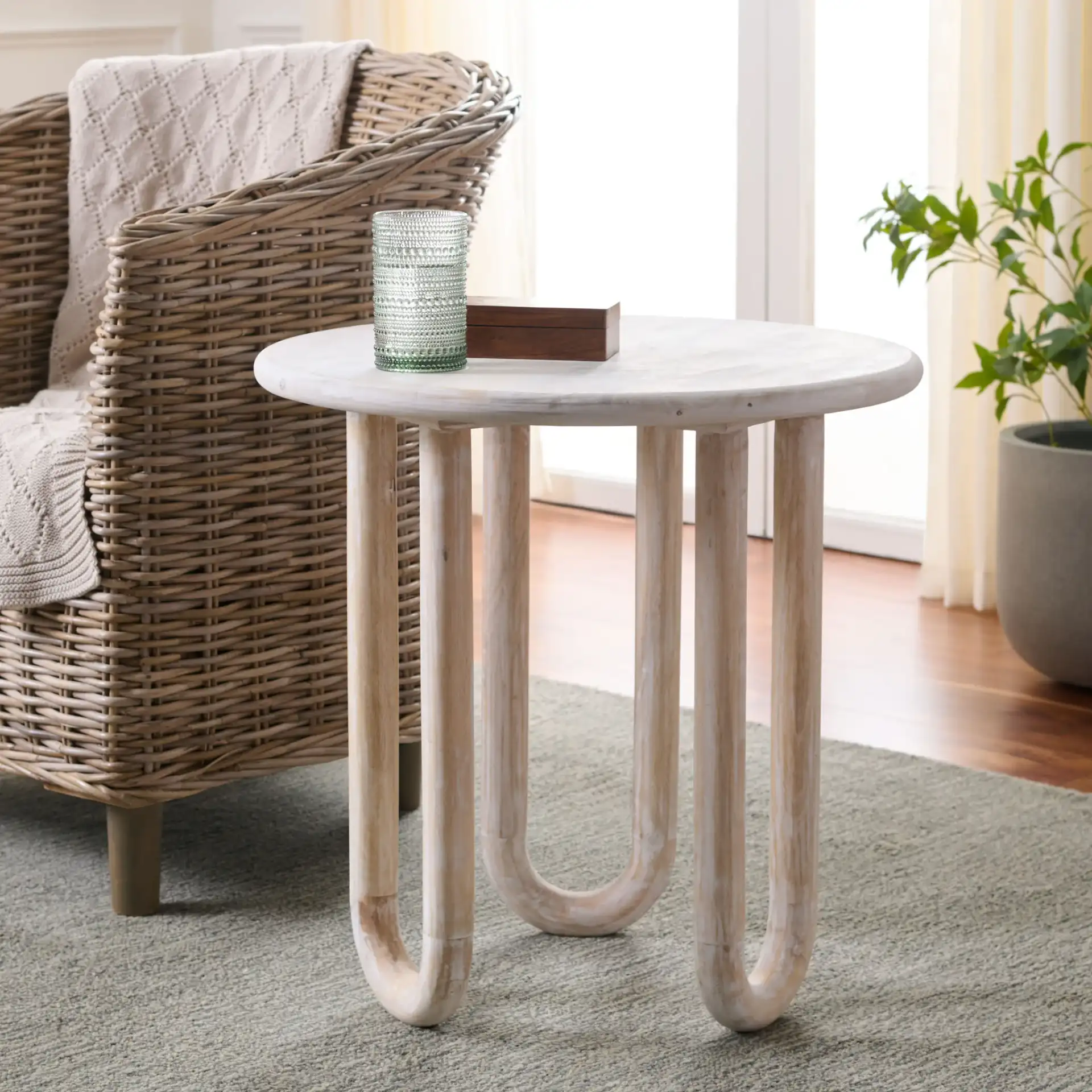 Jazmin Round Accent Table in Natural Wash in a styled room