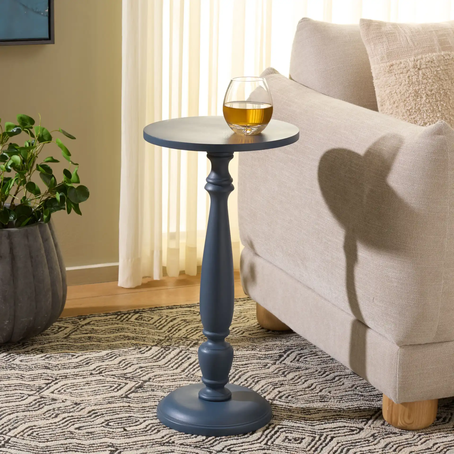 Rhue Accent Table in Navy Blue in a styled room