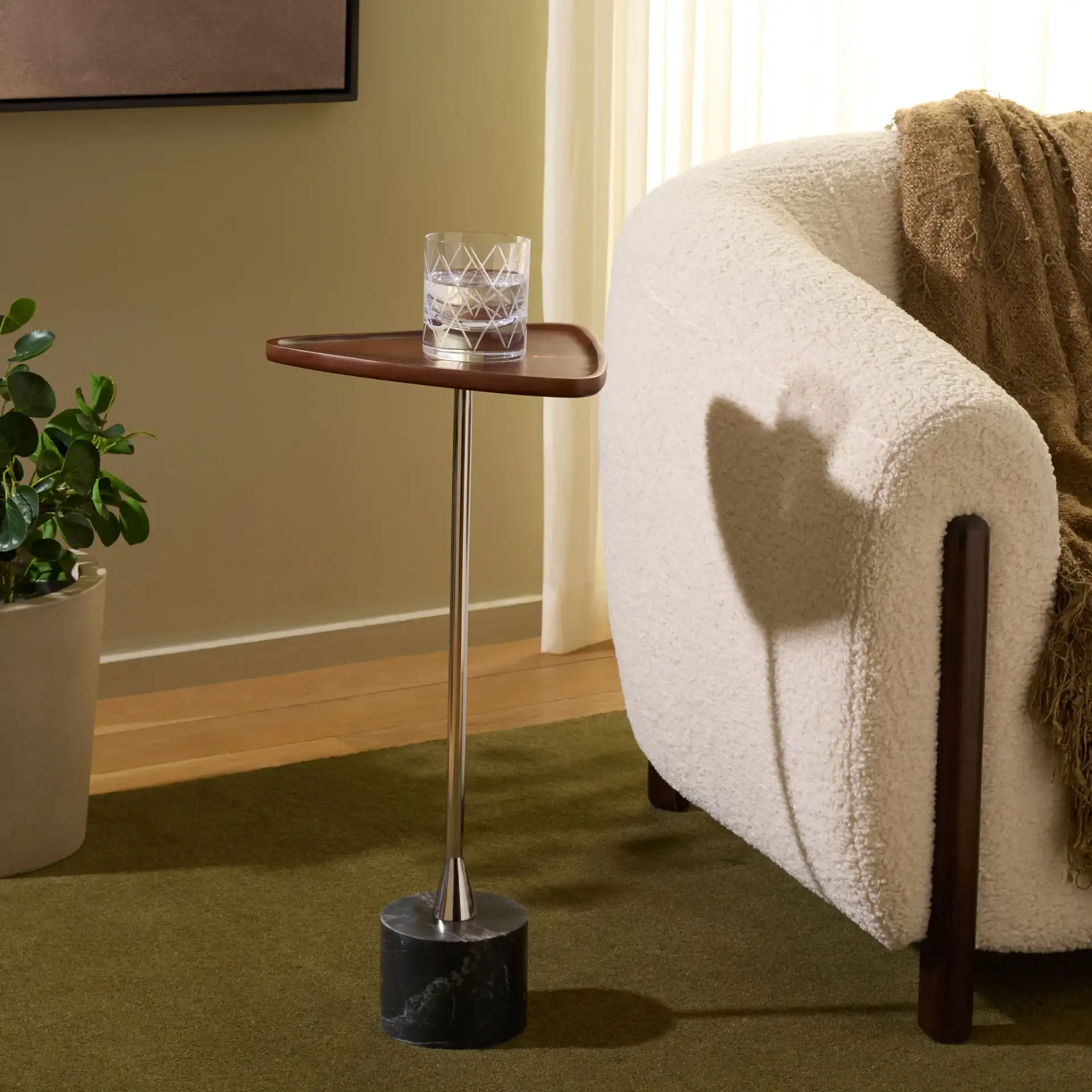 Kristel Accent Table in Brown / Silver / Black Marble in a styled room
