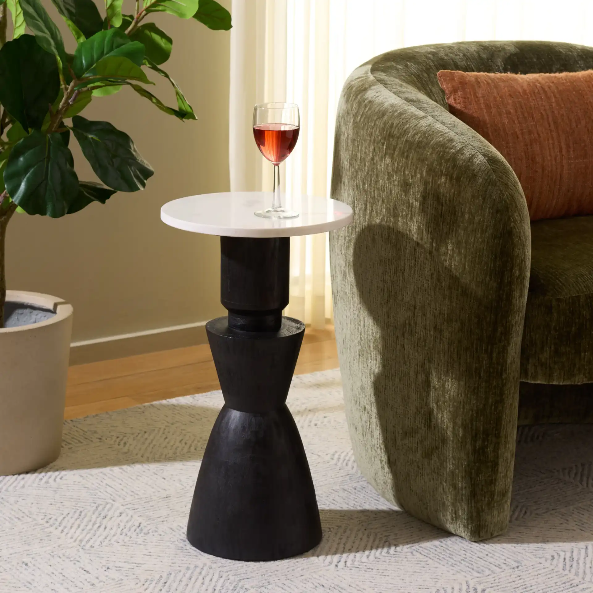 Kyla Accent Table in Black / White in a styled room
