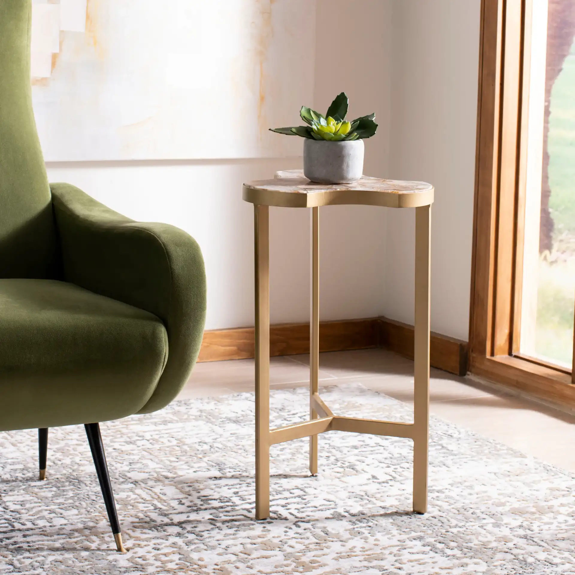 Suki Tripod Accent Table in White Agate / Gold in a styled room
