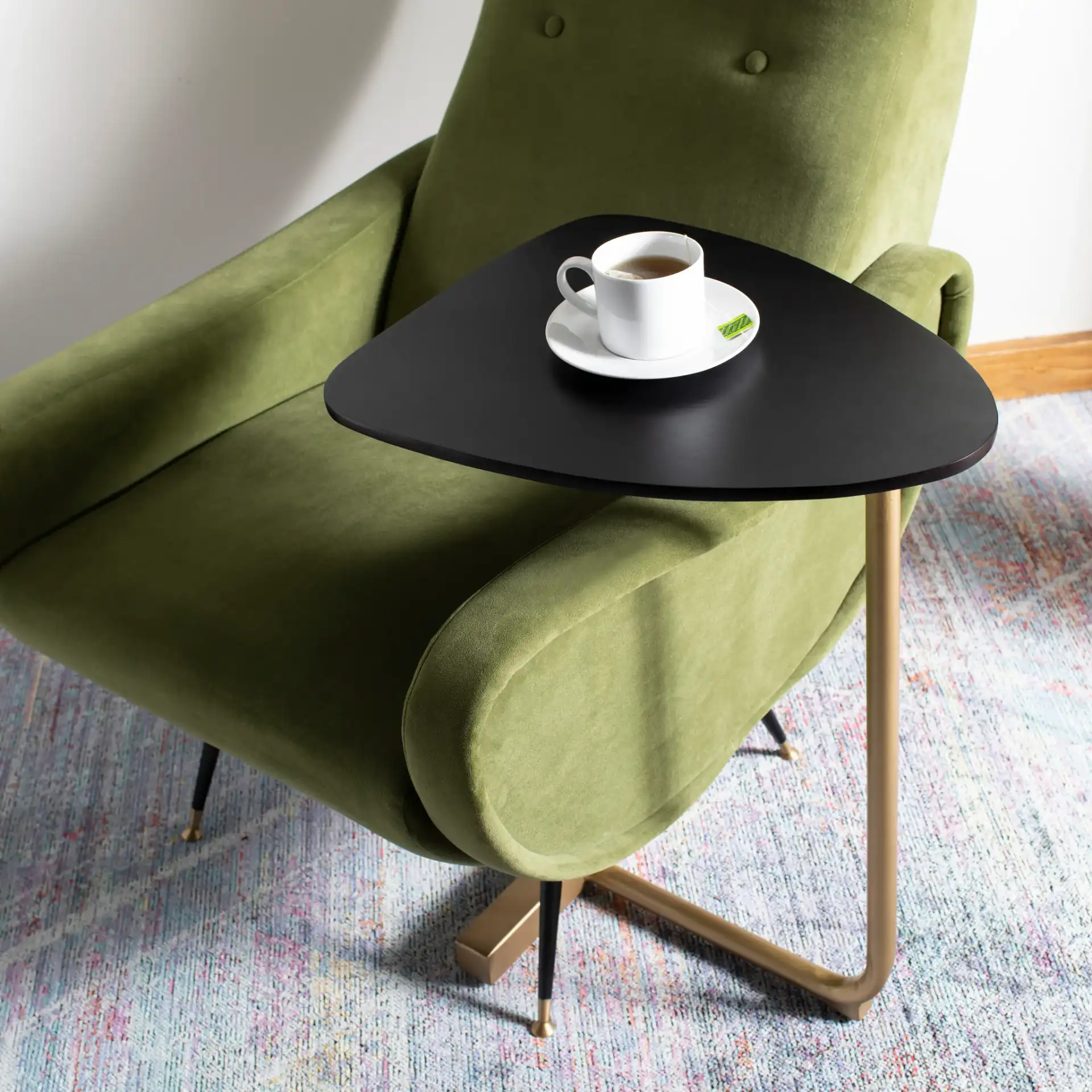 Kaiya C-Table in Black / Gold in a styled room