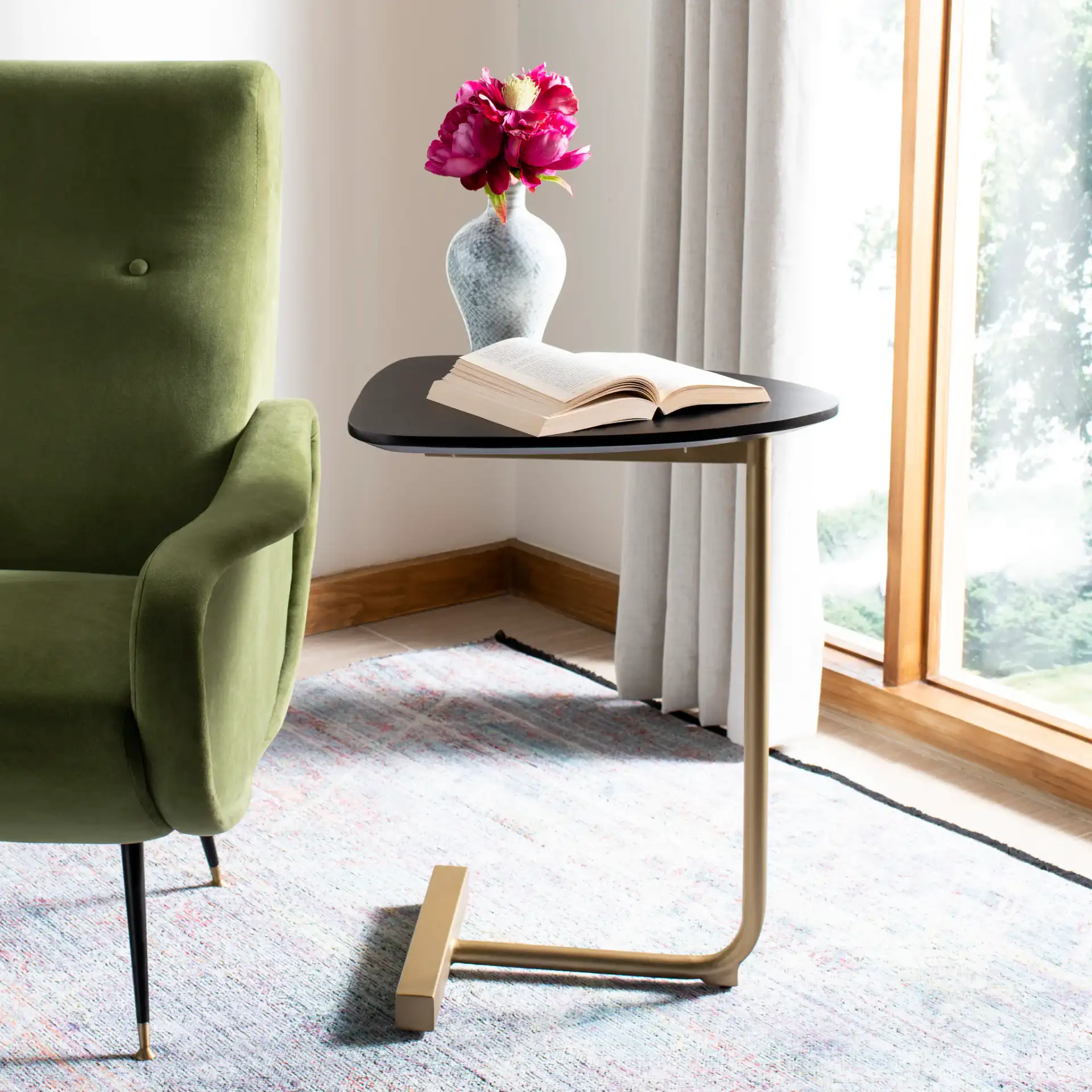 Kaiya C-Table in Black / Gold in a styled room