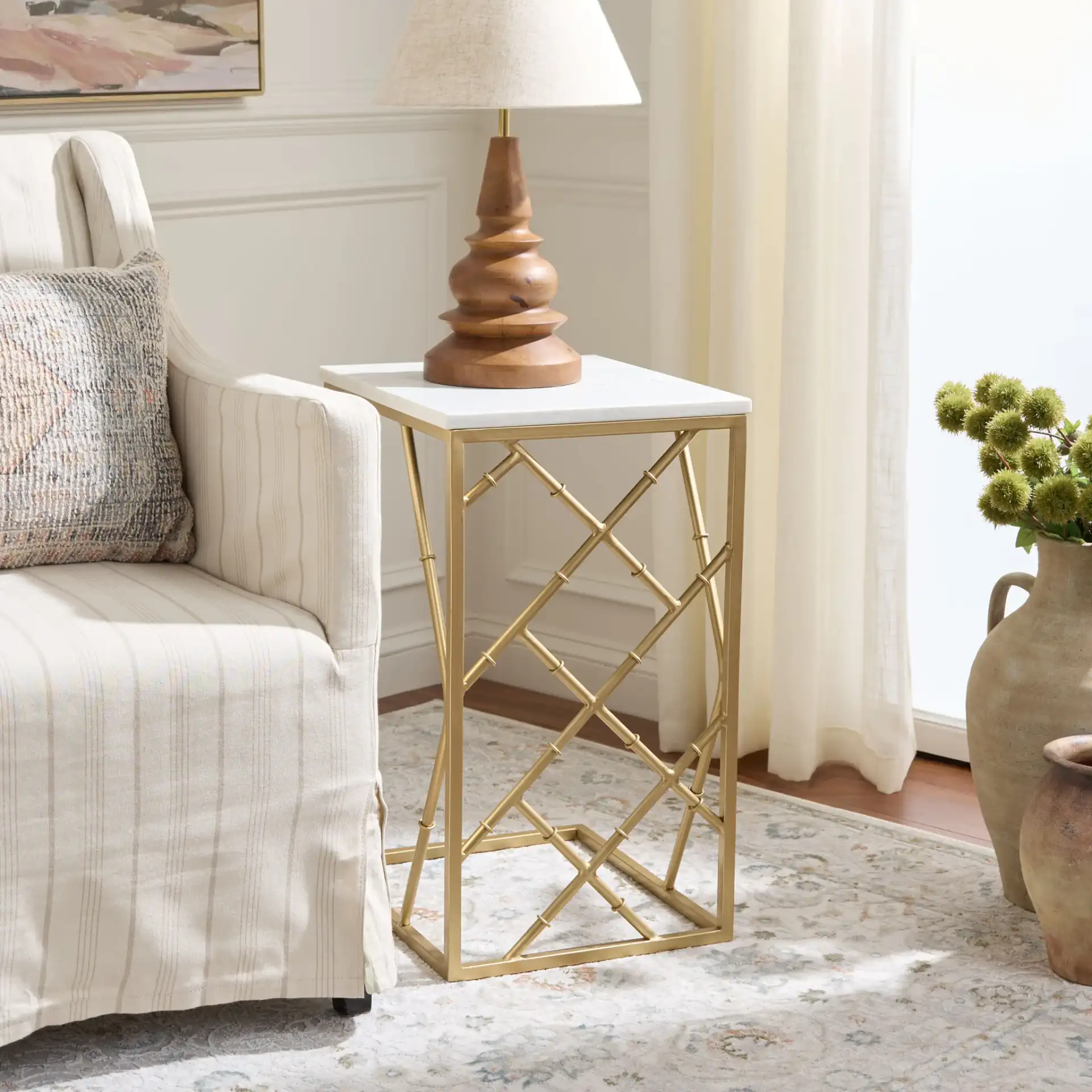 Keston Marble C-Table in White Marble / Gold in a styled room