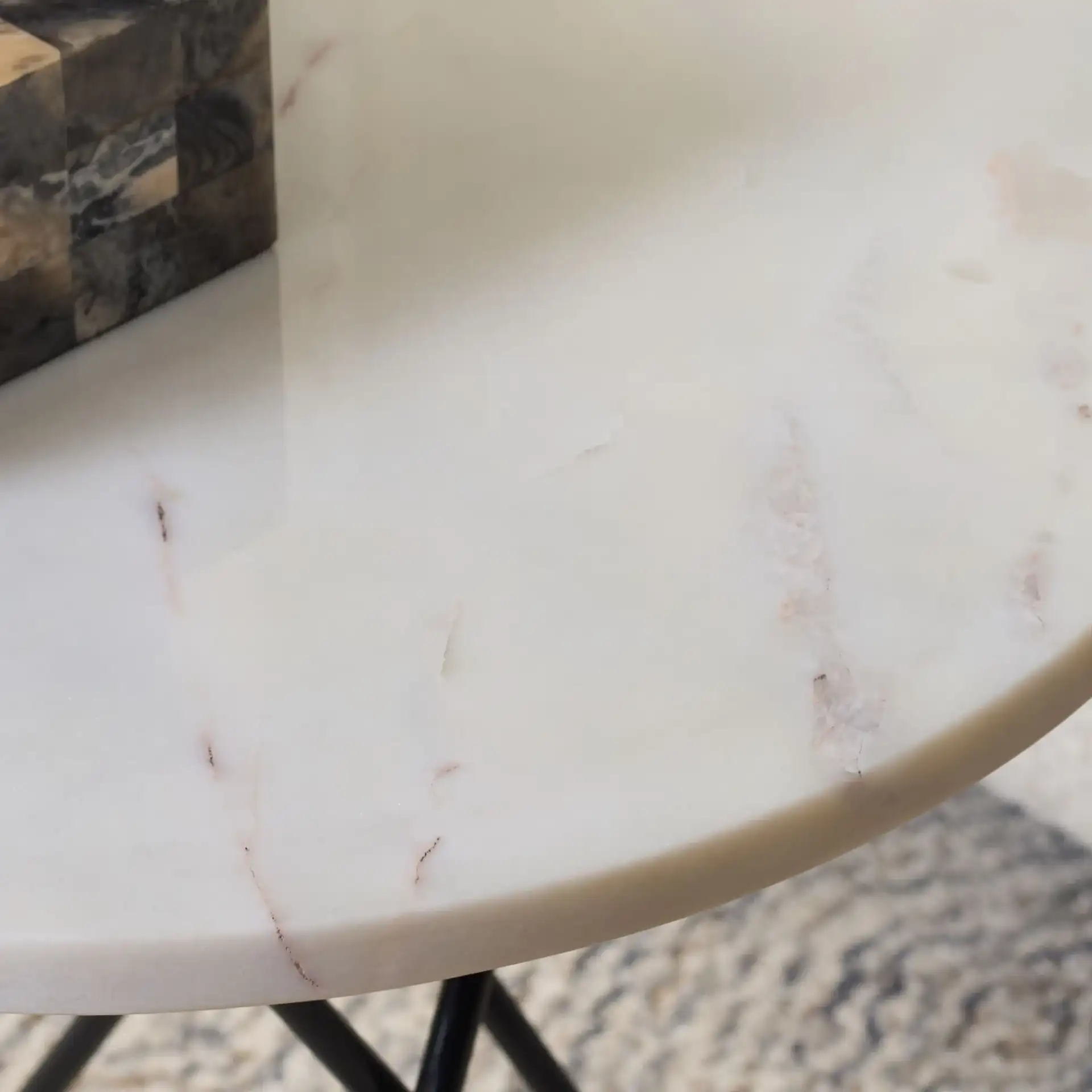 Cade Marble Side Table in White Marble / Black in a styled room