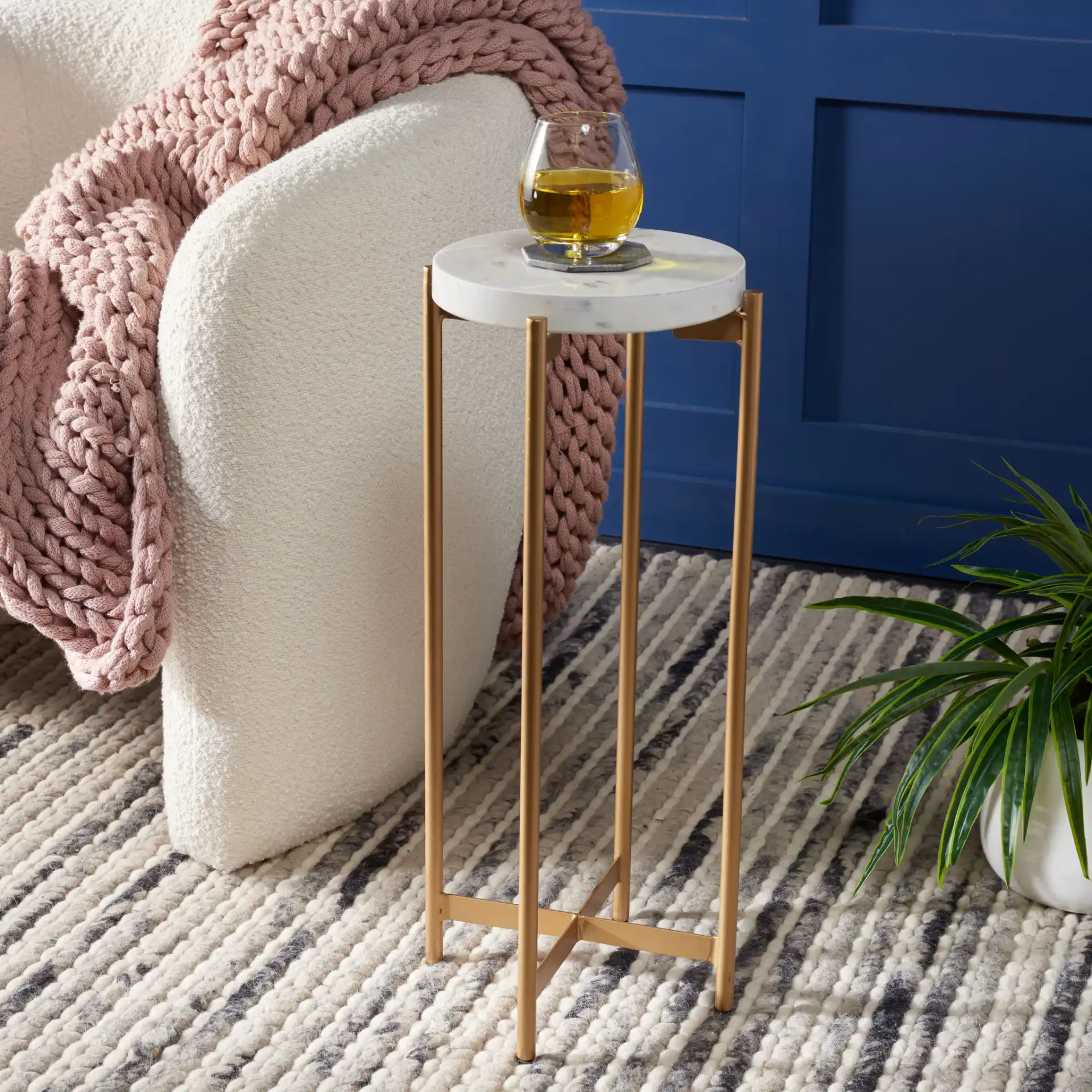 Branwen Drink Table in White Marble / Gold in a styled room