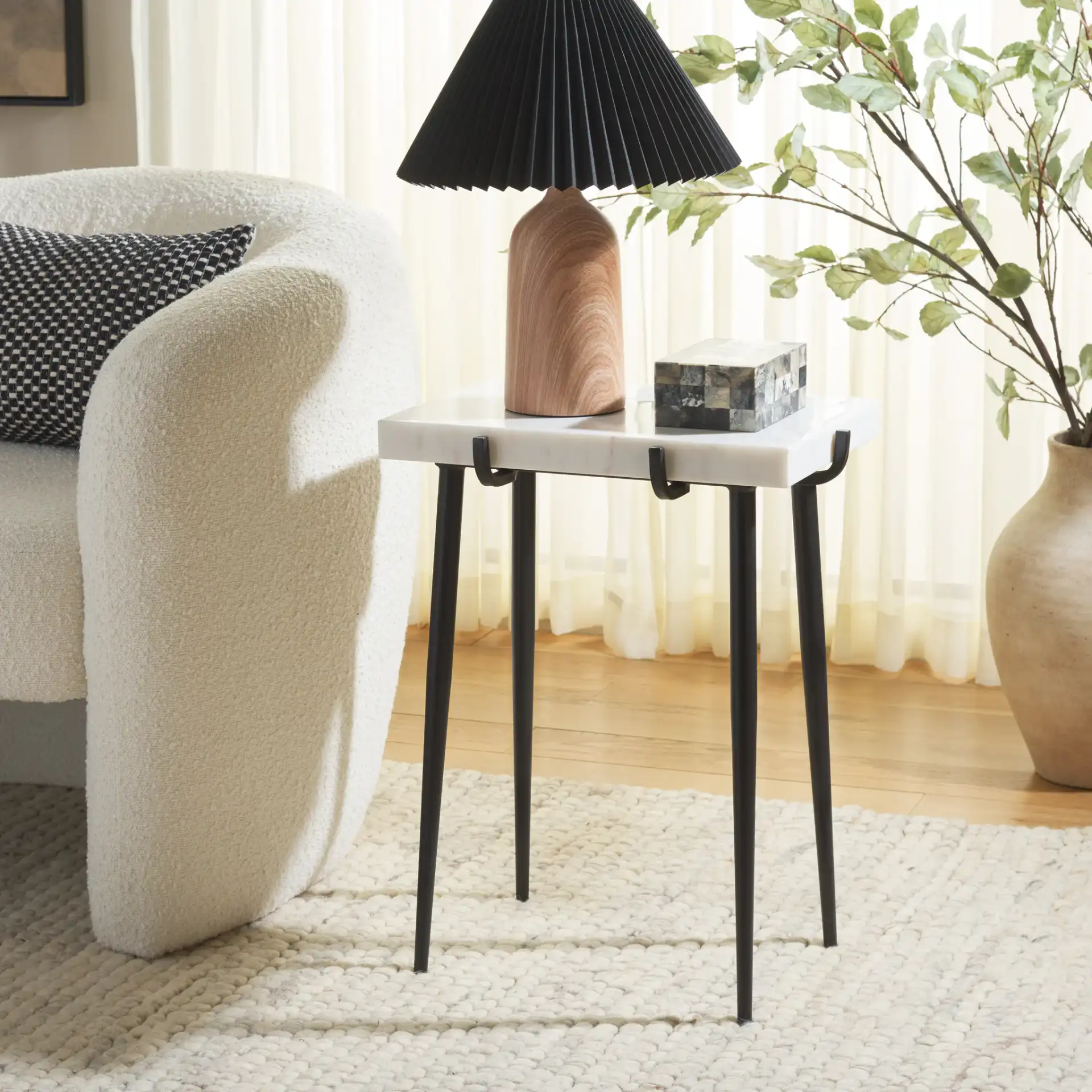 Bremen Marble Side Table in White / Black in a styled room